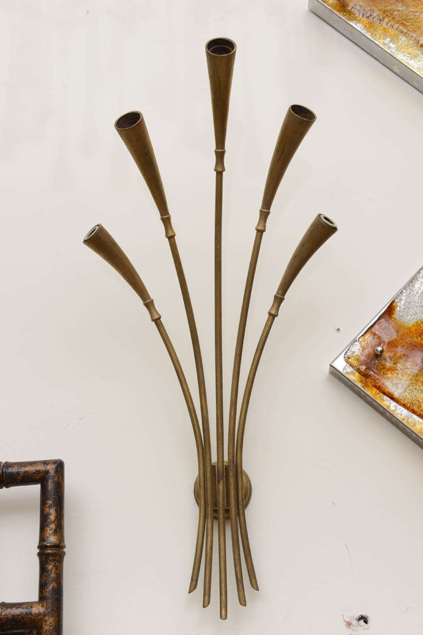 Pair of brass sconces arranged bouquet style. Each sconce has four shades that have been rewired for the USA.