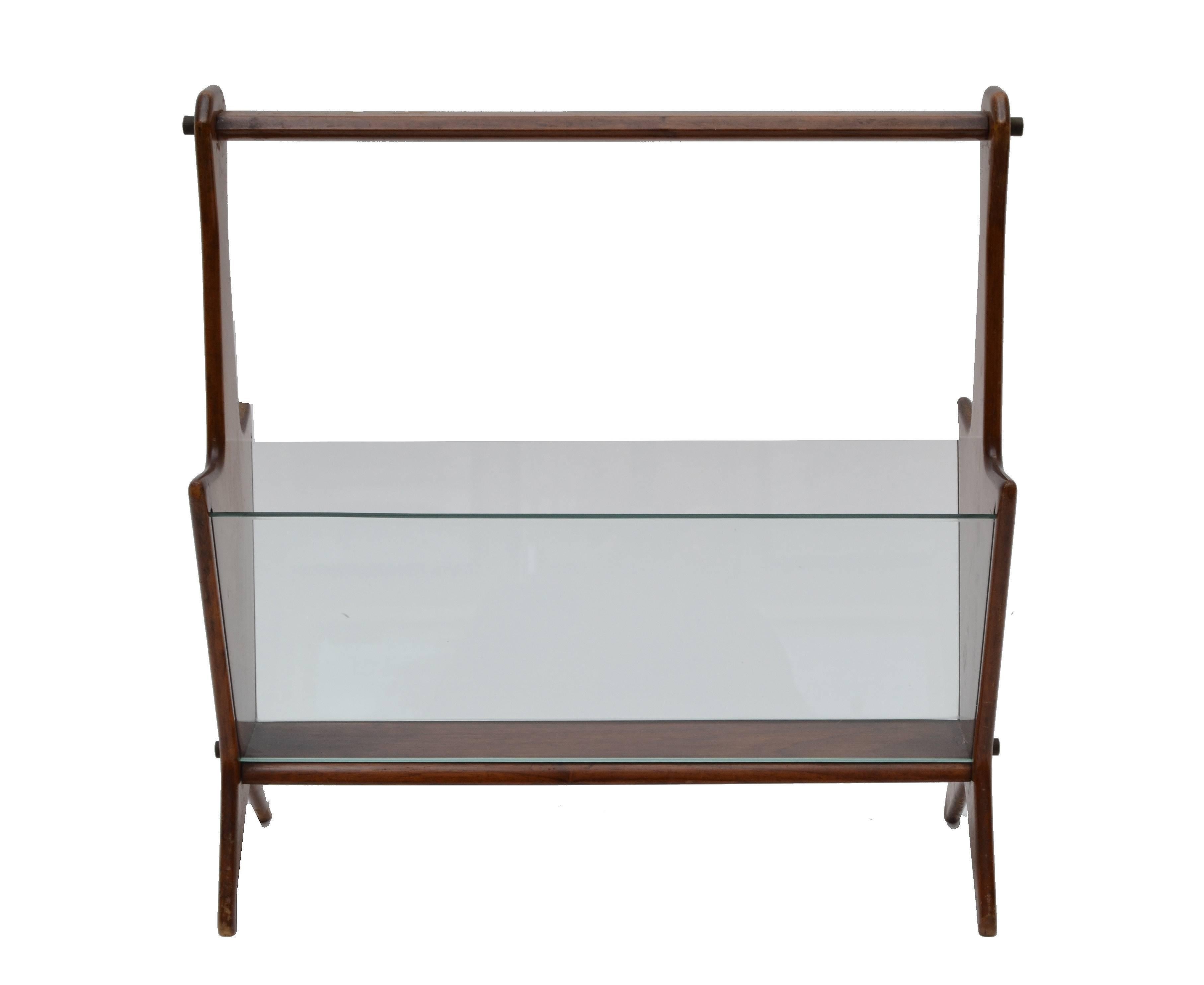 Super chic Ico Parisi Art Deco handmade mahogany magazine rack from Italy made in the 1940s.
Features two glass sheets to find your favorite magazines or books with one grip.
This piece is as functional as decorative.
