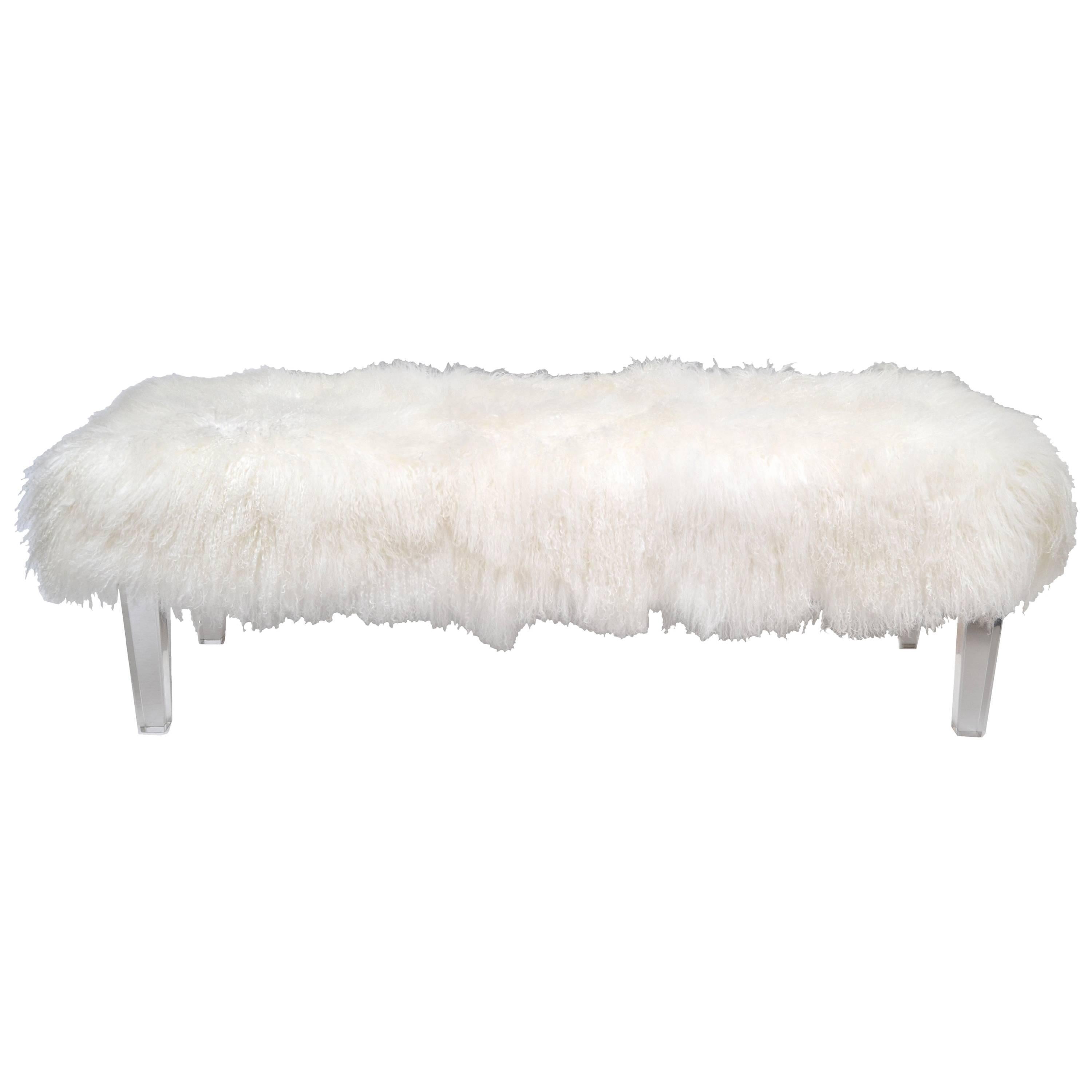 Modern bench with exotic Tibetan sheepskin in ivory.
Fabulous bench has a sturdy platform supported by four custom-made Lucite legs.
The Tibetan Sheepskin seating surface is in the original format and can be trimmed if so desired.
New and made to
