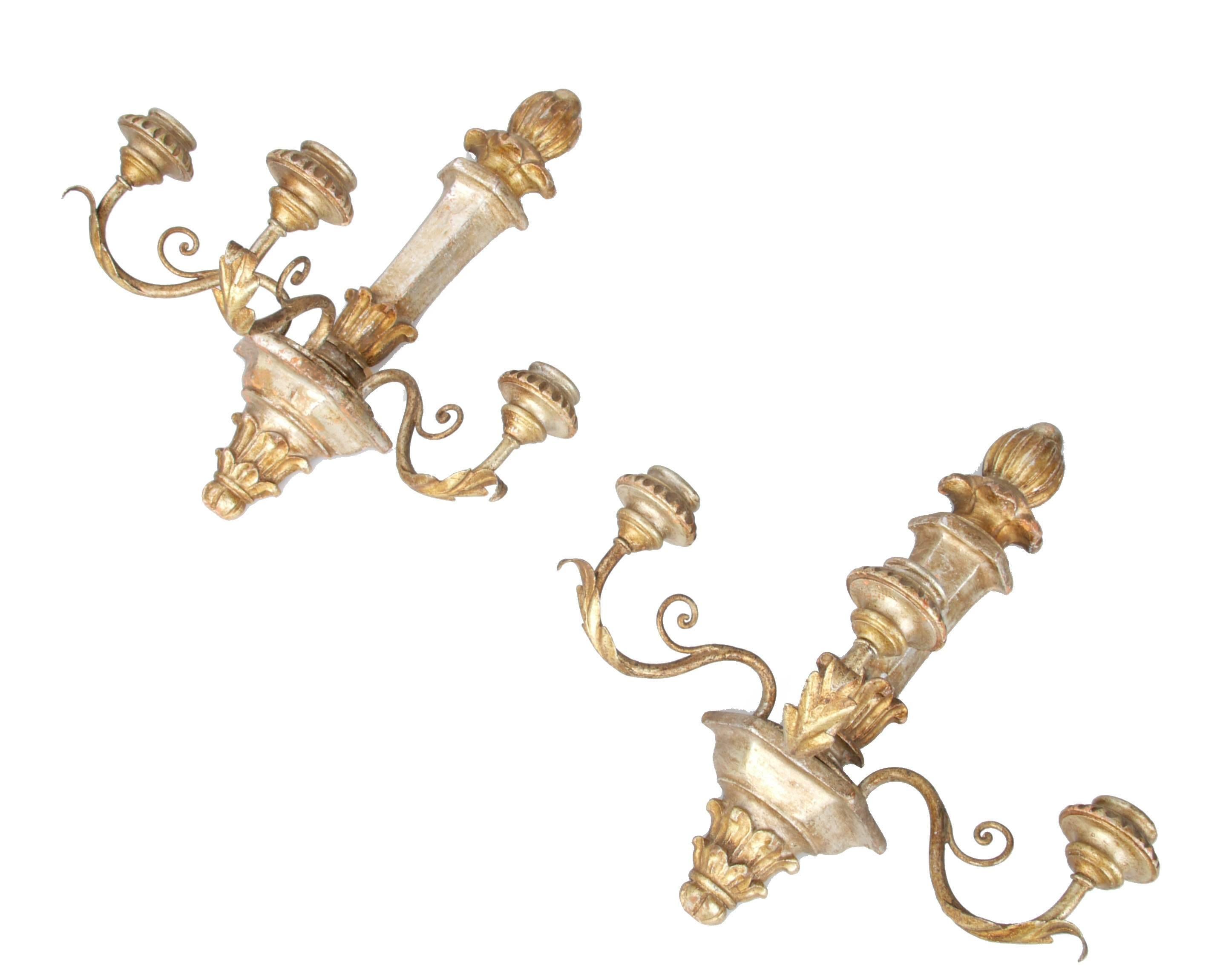 Offered is a pair of three-arm non electrified wooden wall sconces. The candle arms are metal with a golden finish.
Can be easily mounted to the wall.
