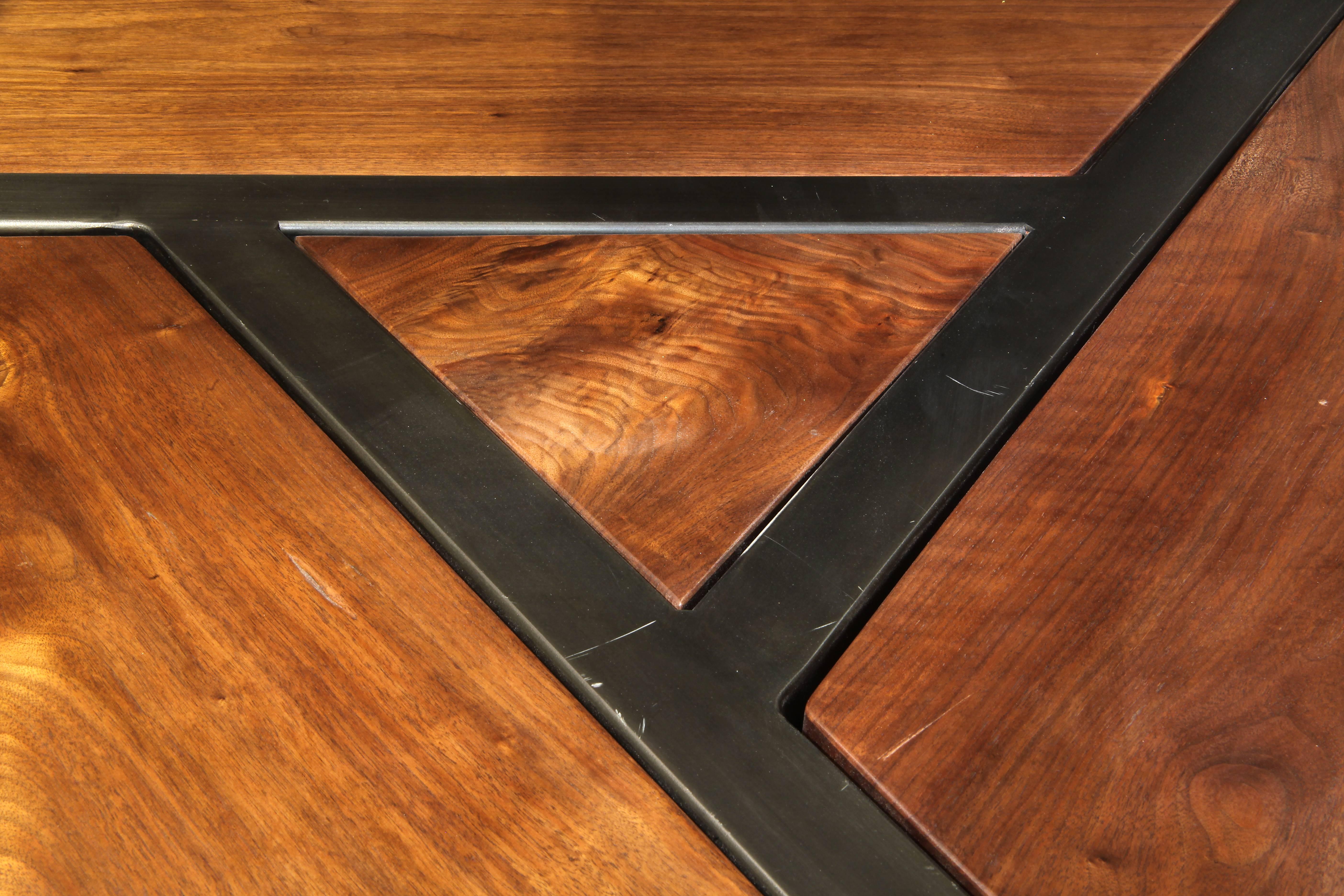 Taking cues from the cracked-ice latticework pattern found in traditional Chinese woodwork, this handsome kitchen table was handcrafted from a locally salvaged tree trunk of American black walnut grown in Cook County. Three bookmatched sections