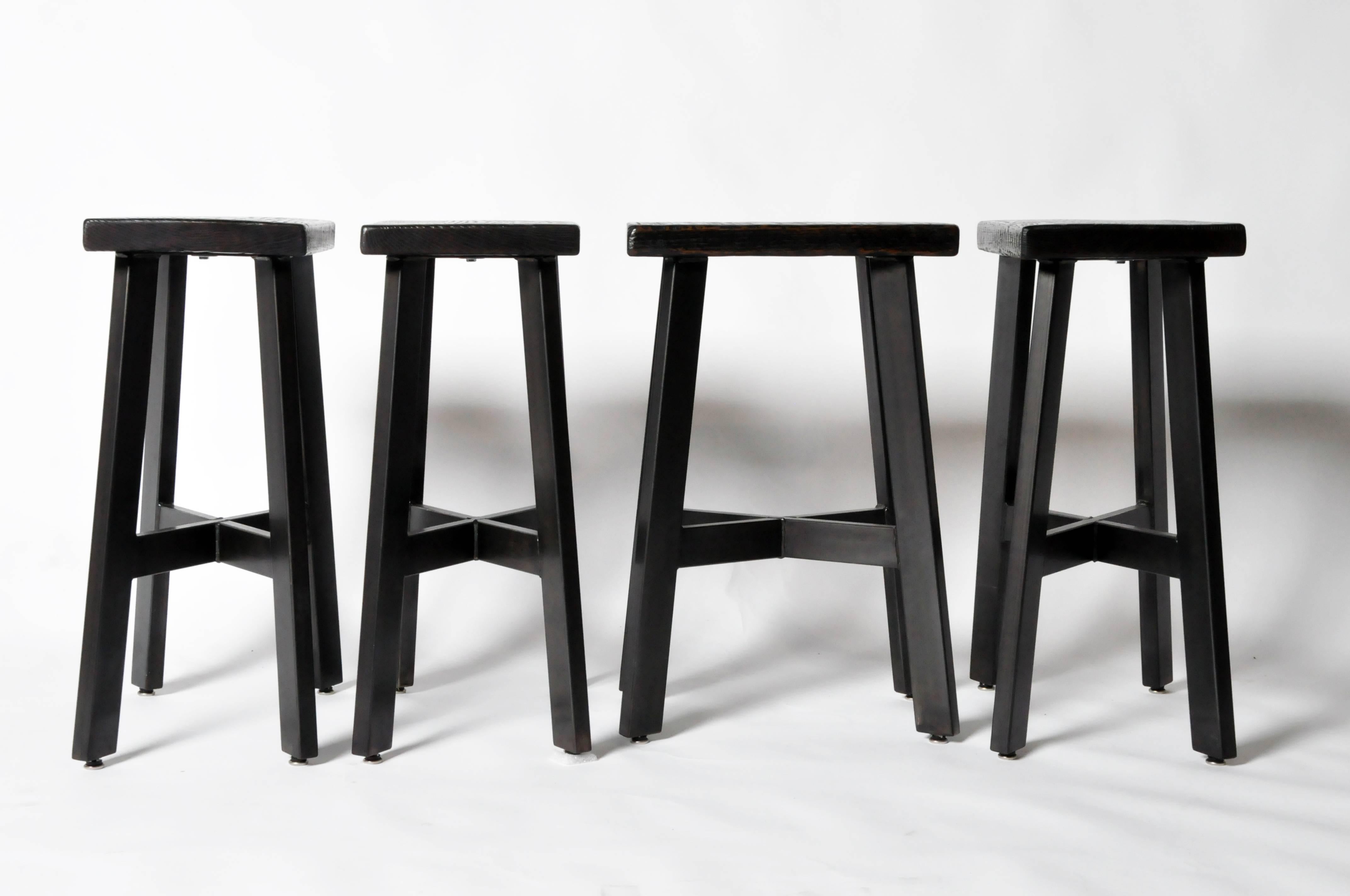 These counter stools are made with a steel leg base with a wooden seat. They are ideal seating for bar counters.