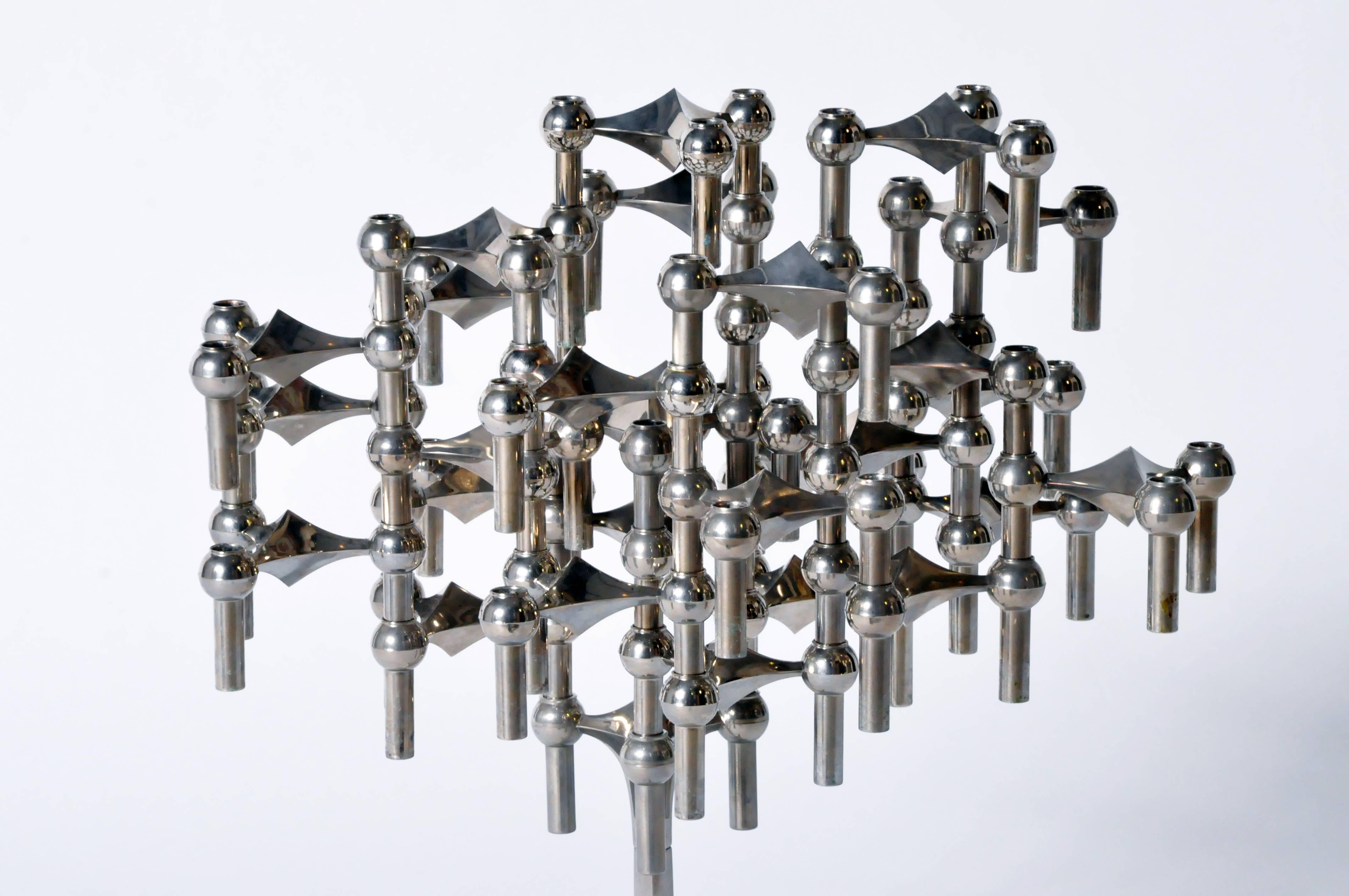 This modular candelabrum was created by Fritz Nagel and Caesar Stoffi, and manufactured by BMF (Bayerische Metalwarenfabrik). Comprised of 30 individual, stackable chrome elements this versatile and unique creation makes quite the statement. A tall