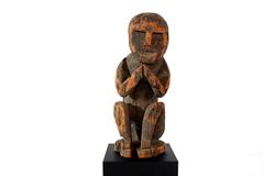 Naga Effigy Carving of a Squatting Man