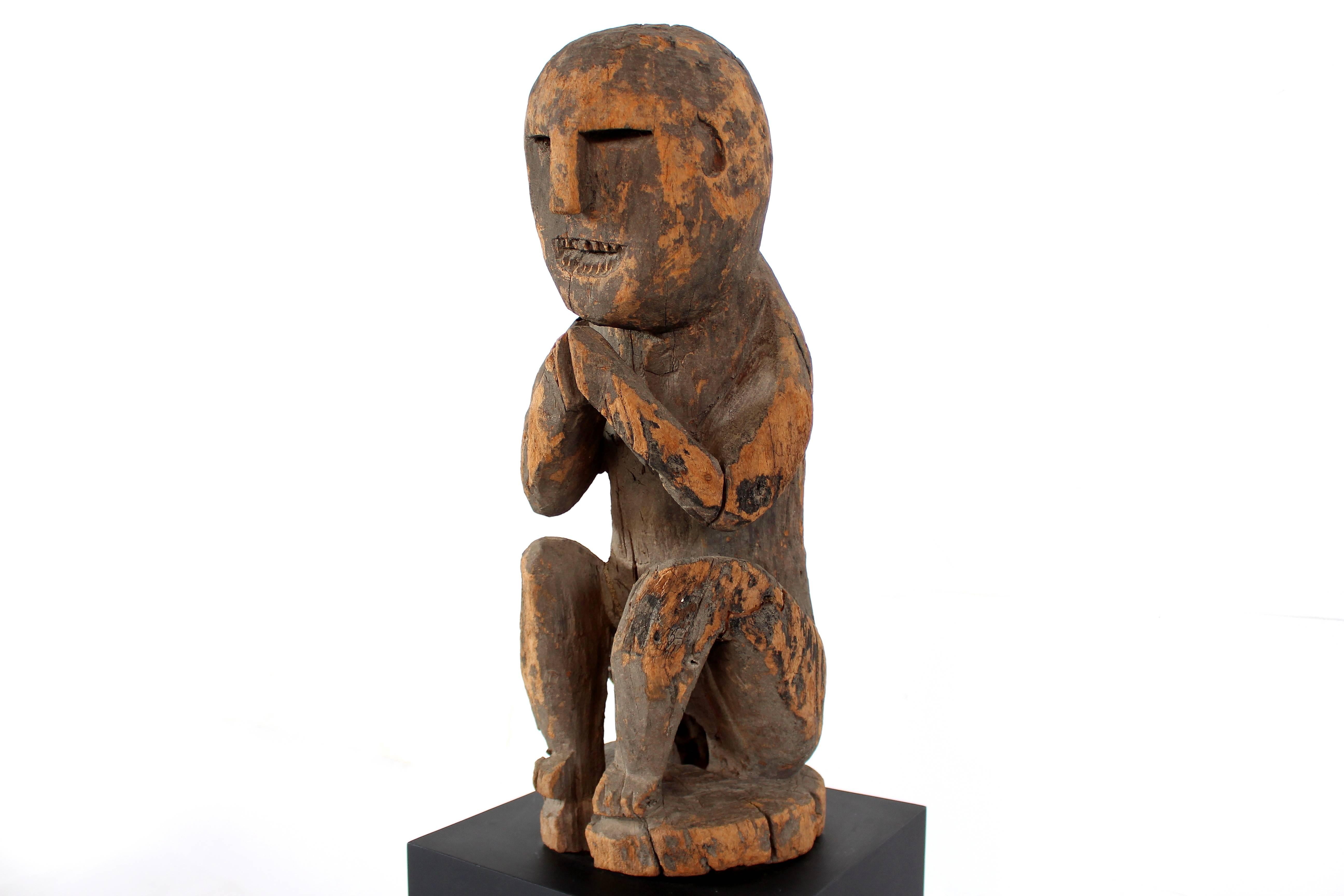 squatting man sculpture