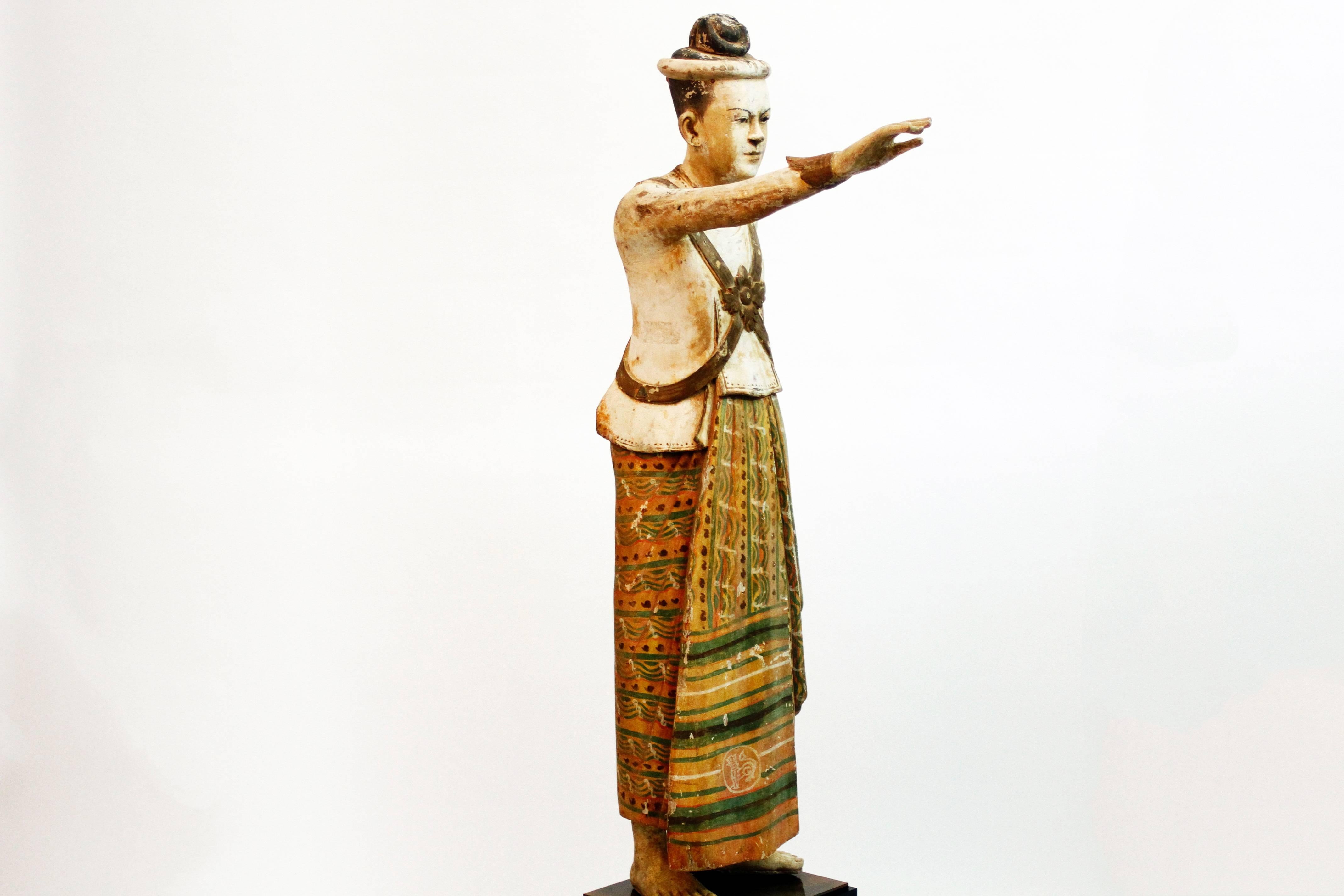 This monumental hand-carved statue is of a Burmese King. It is from Rangoon, Myanmar and is made from teakwood, early 19th century.