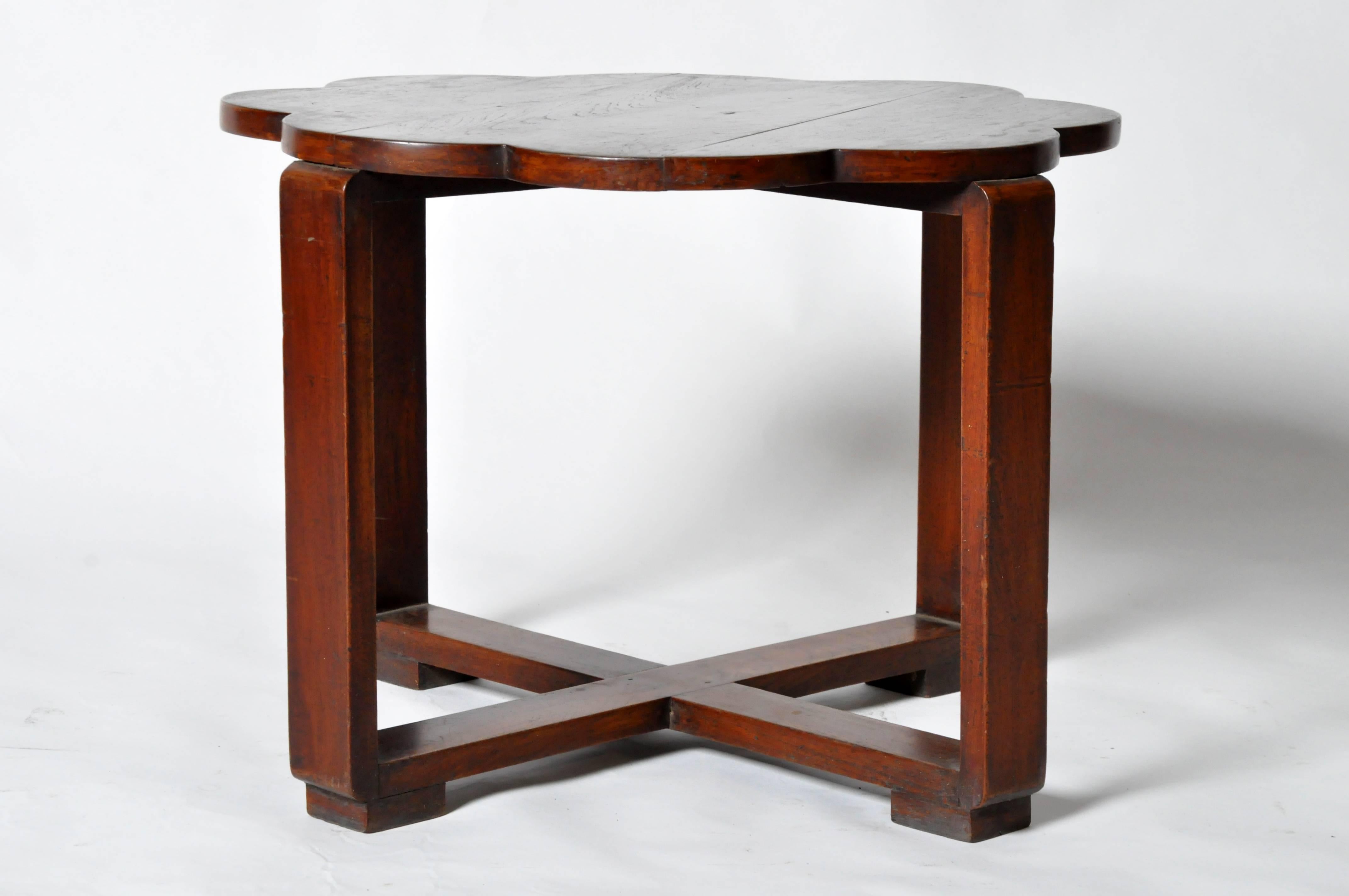 This Art Deco low table is from Burma (now Myanmar) and is made from teak wood. This type of table was usually placed in the center of a set of four chairs on a veranda. Finish is original. 