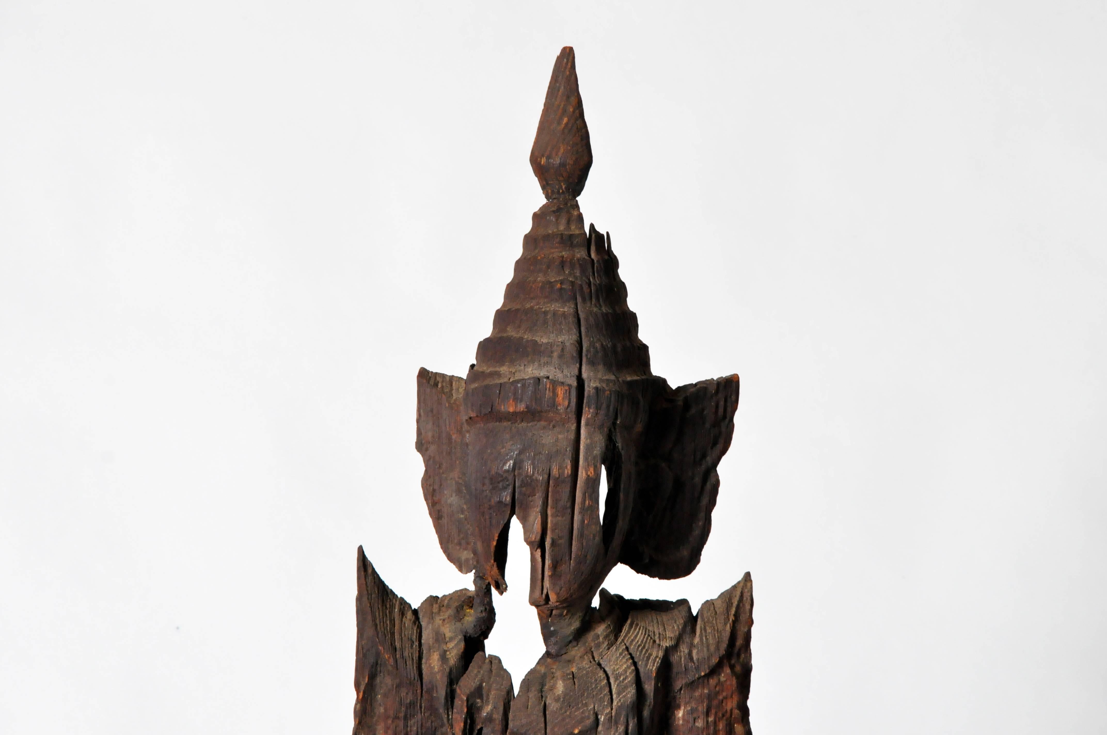 This beautiful greeting angel is from Thailand and is made from teakwood. This type of angel holds its hands clasped together in a respectful wai and wears a heavenly costume decorated with pointed winglets and a draped skirt. According to Therevada