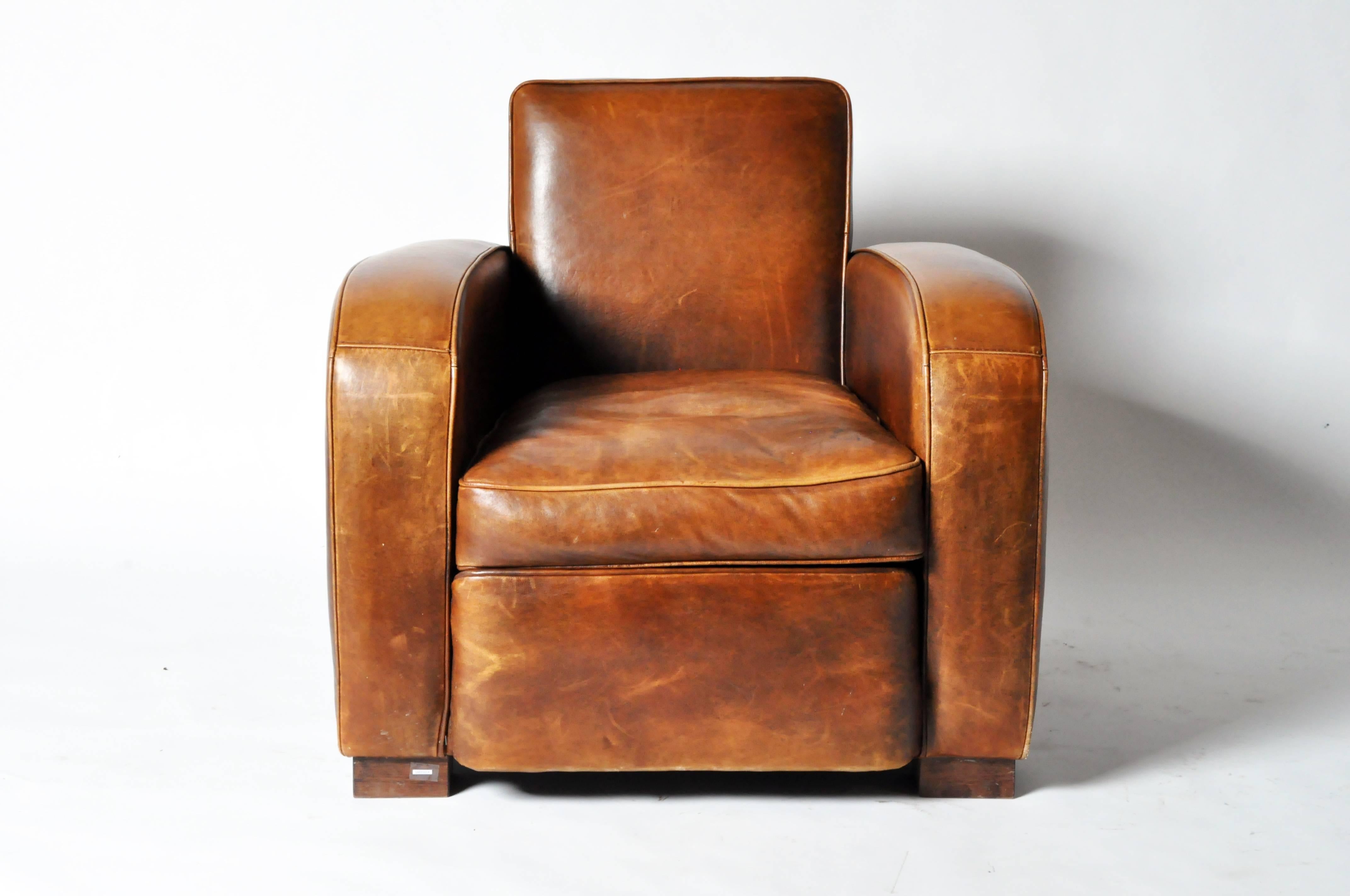 This comfortable pair of club chairs gently contour to any body shape. The arms of the chairs are slightly arched.