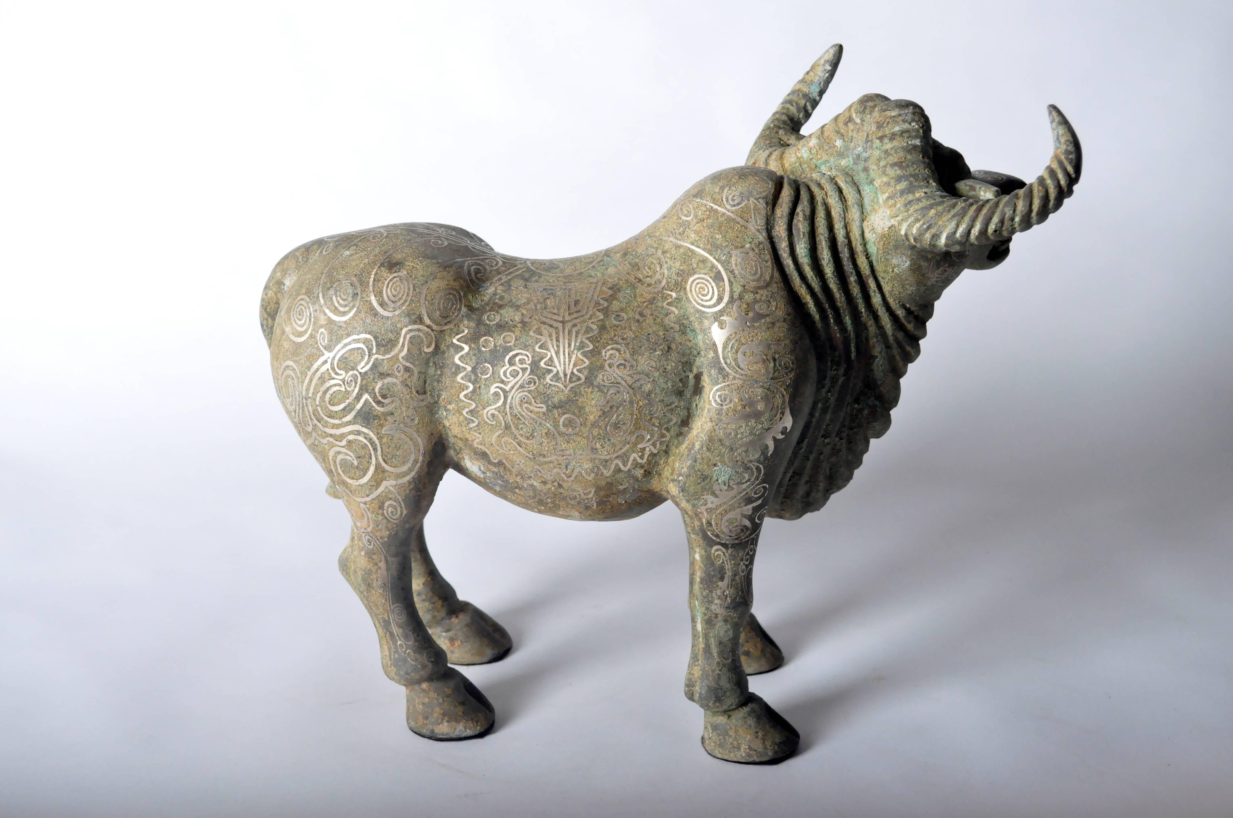 Bronze bull sculpture from Shanxi, China with fine detail.