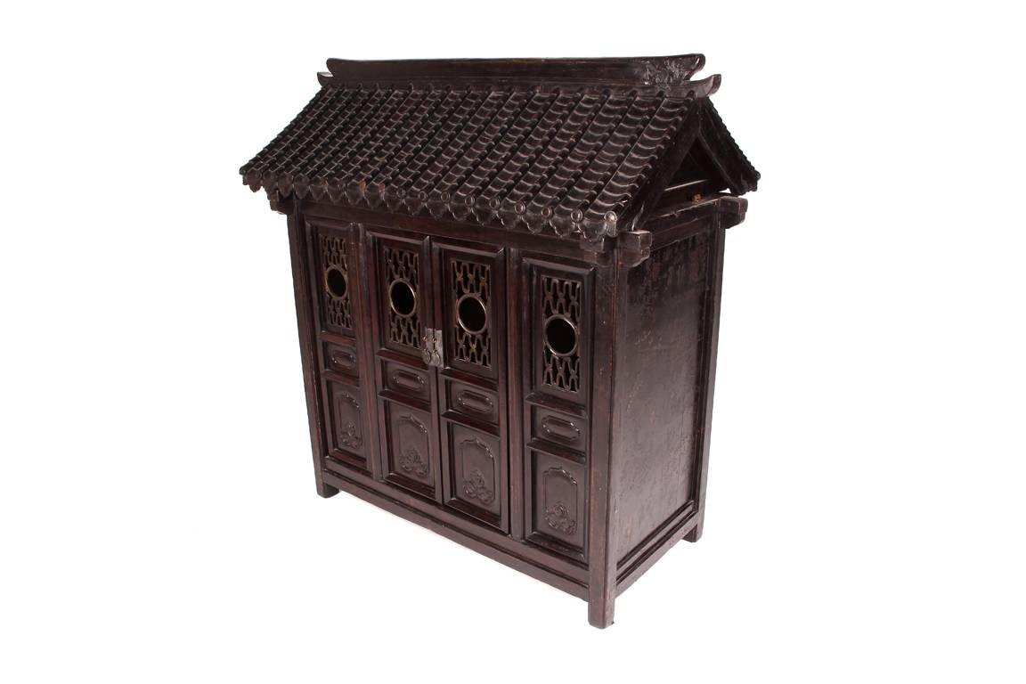 This Chinese shrine is from Hebei, China late 1700s and is made from elmwood and black lacquer.