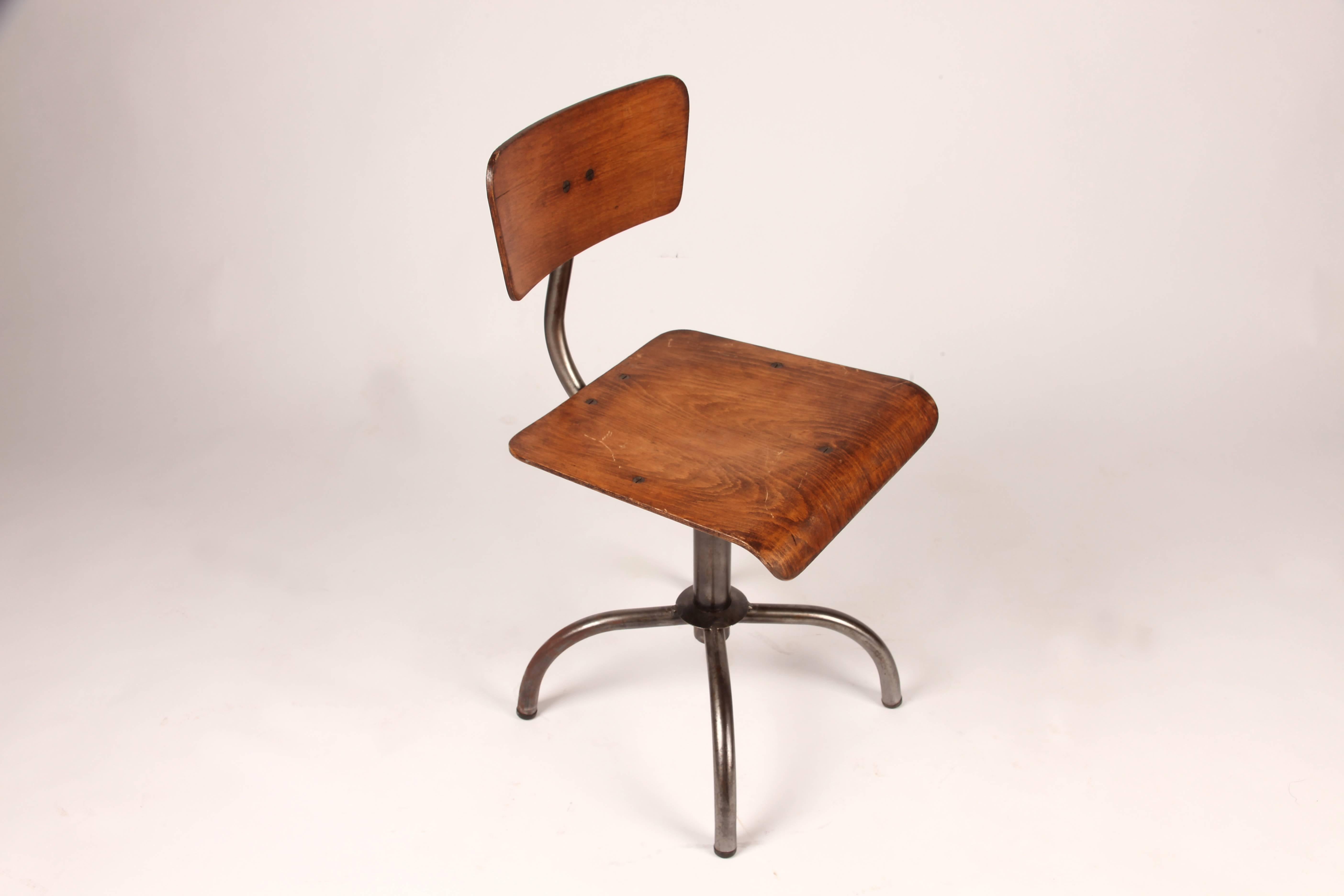 These Industrial chairs are from France and are made from pine wood and metal, circa 1950.