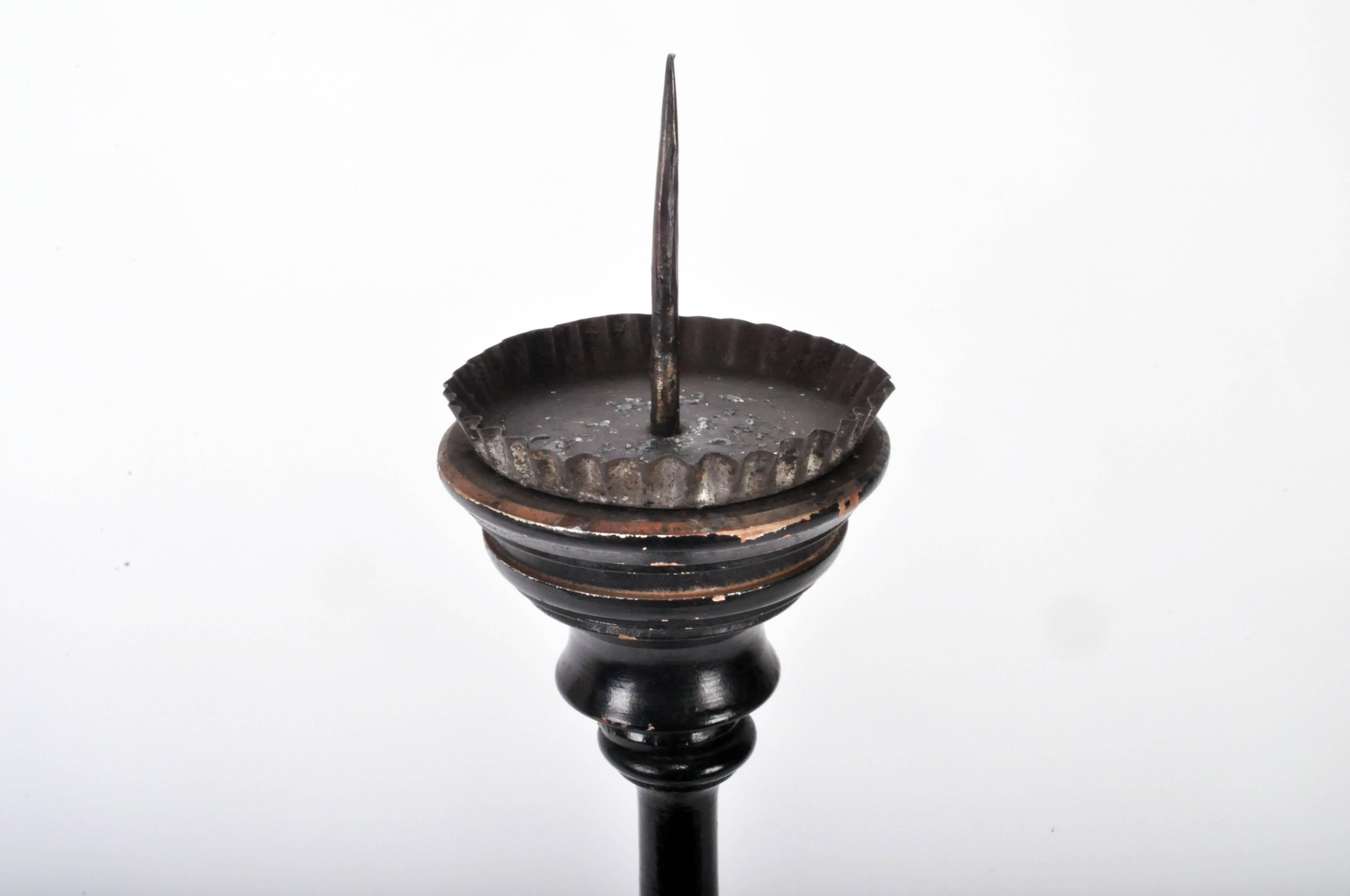 This black candle stand is from France and made from pinewood, mid-19th century.