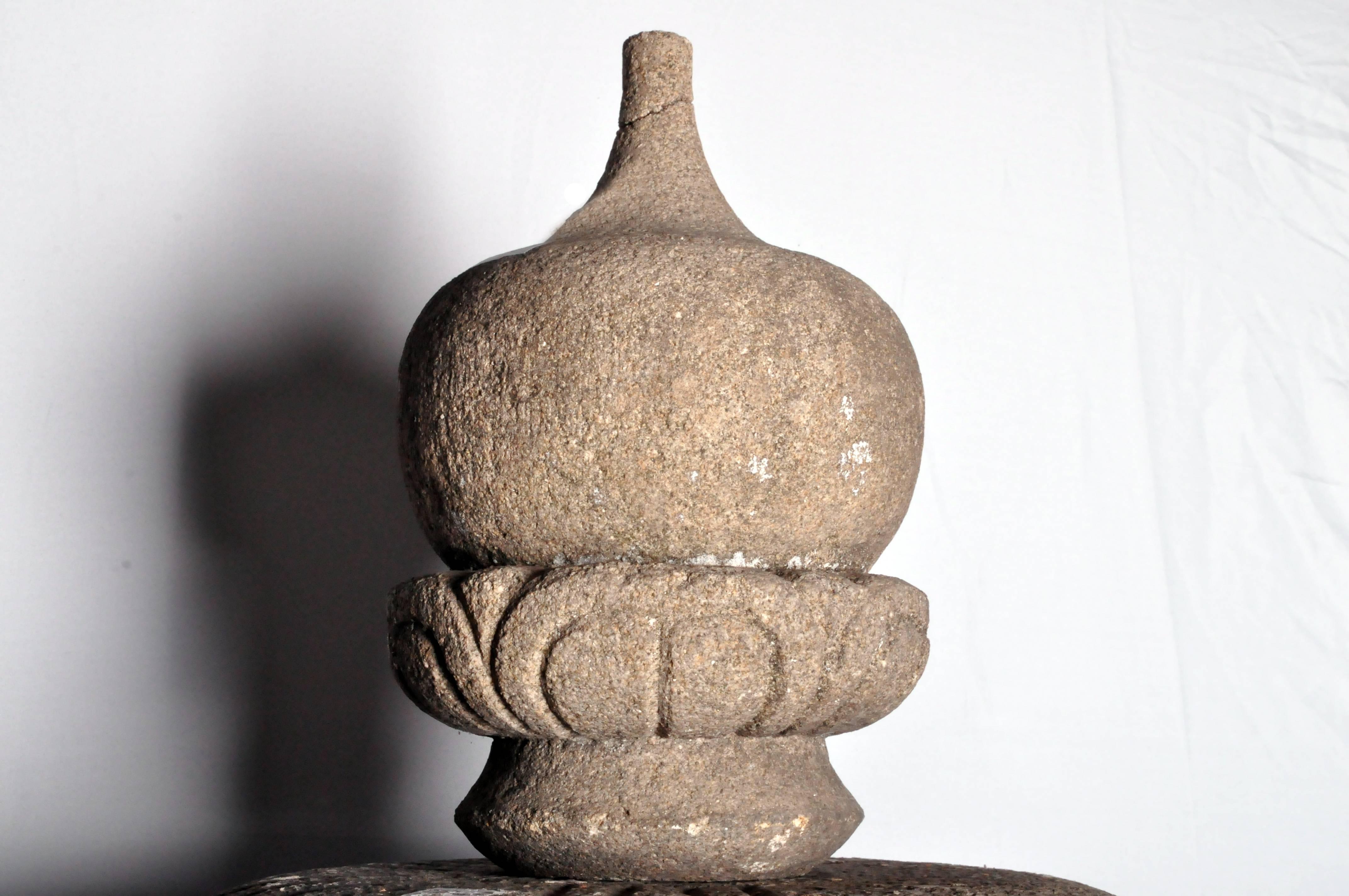 Japanese stone lanterns were first used in ancient Shinto shrines where they served as votive lights. In the 16th century Japanese tea masters included the lanterns in Buddhist tea gardens as a means to light pathways. Solid yet elegant, these
