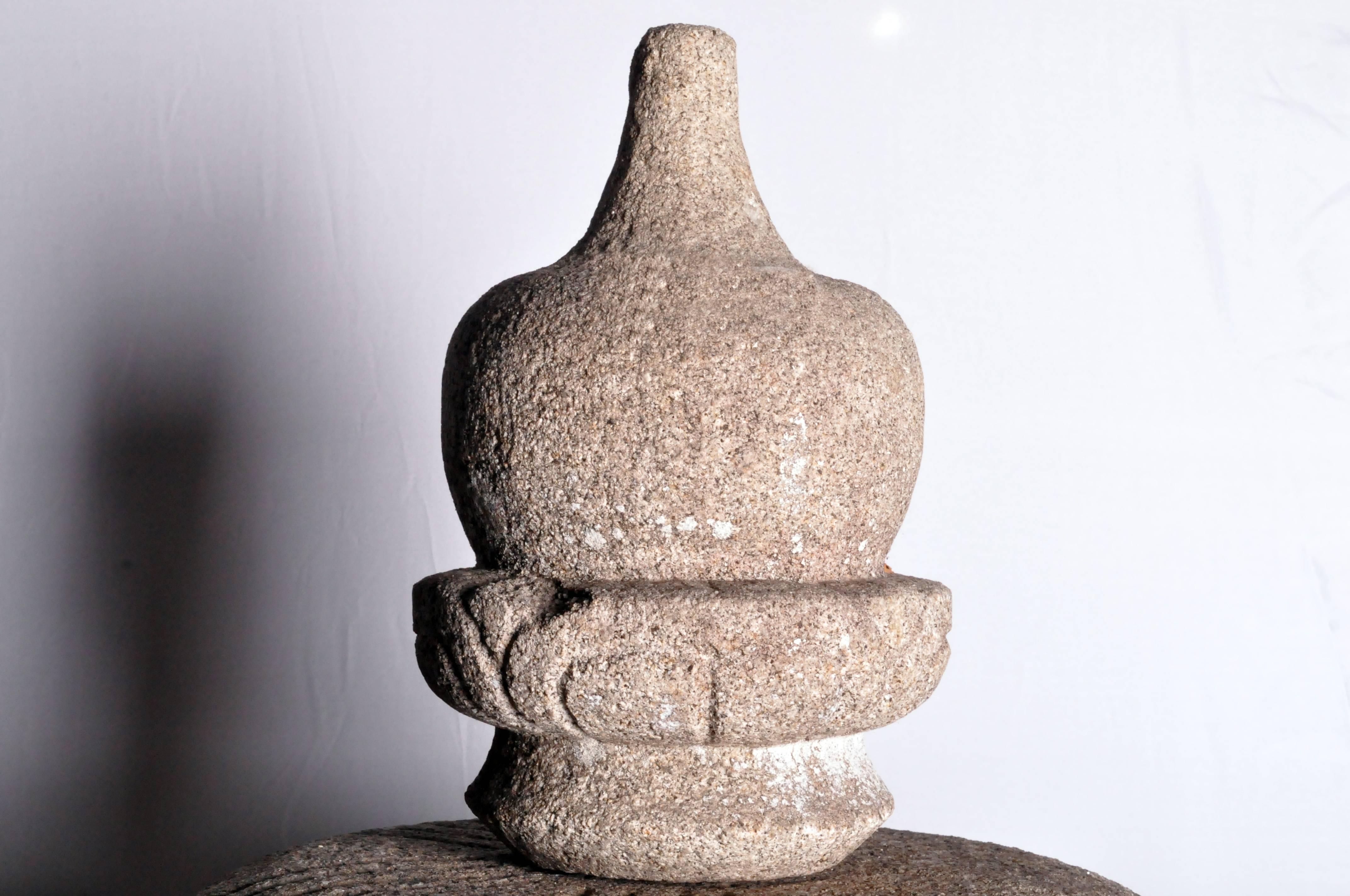 Japanese stone lanterns were first used in ancient Shinto shrines where they served as votive lights. In the 16th century Japanese tea masters included the lanterns in Buddhist tea gardens as a means to light pathways. Solid yet elegant, these
