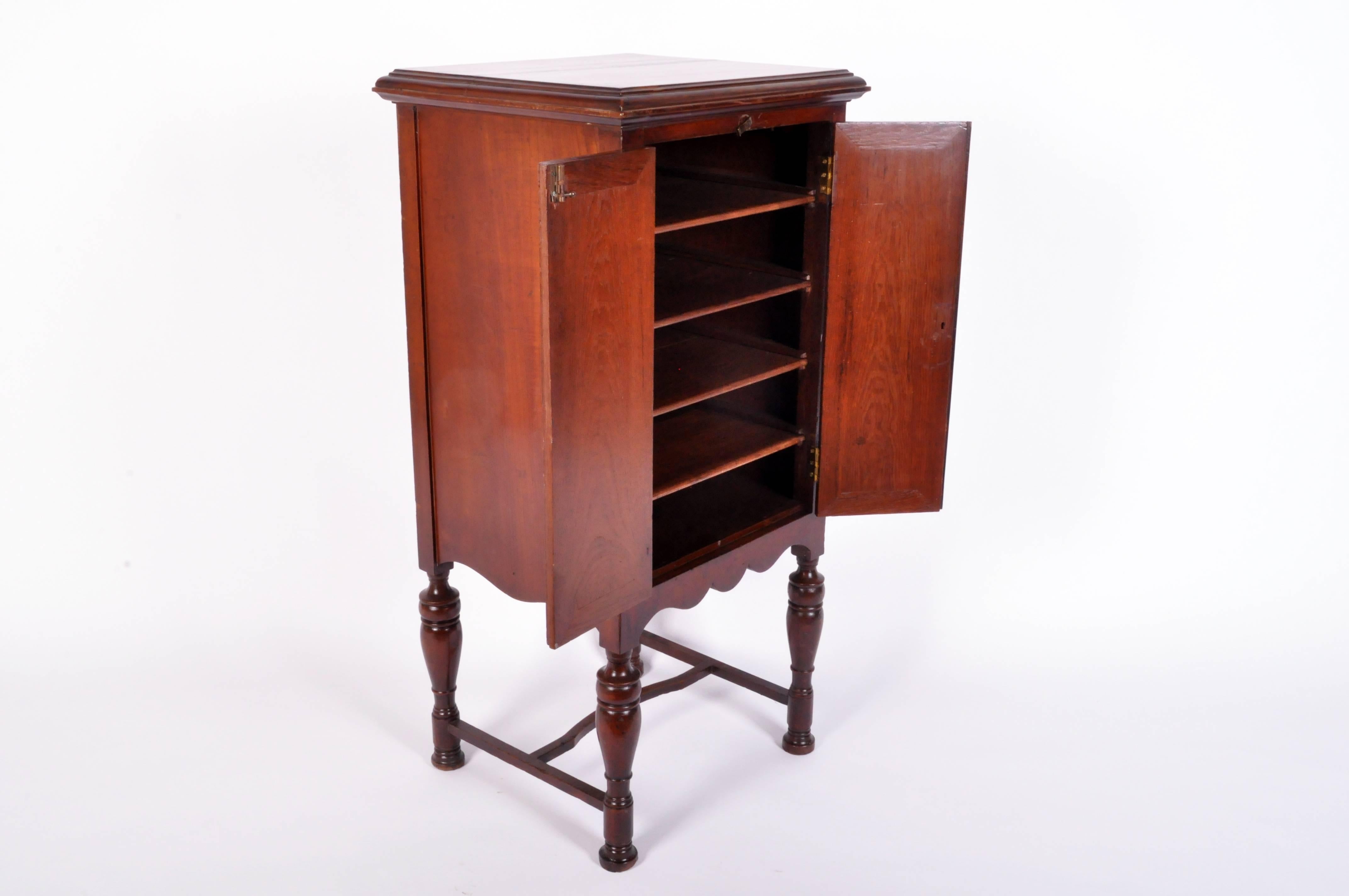 This British Colonial music cabinet is from Myanmar circa 1910 and is made from teakwood.