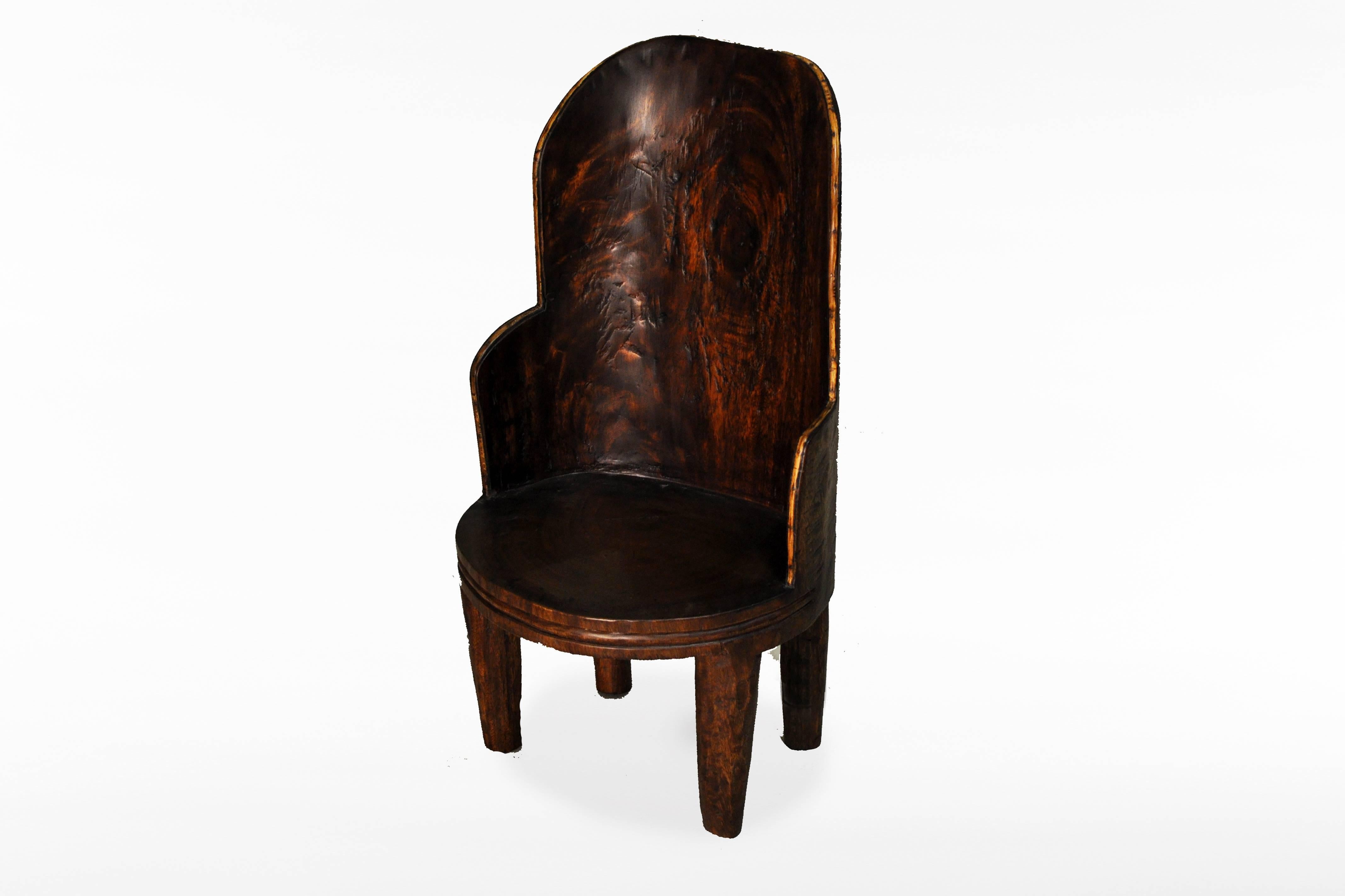This Naga tribe style chair is from Thailand and is made from chamcha wood.