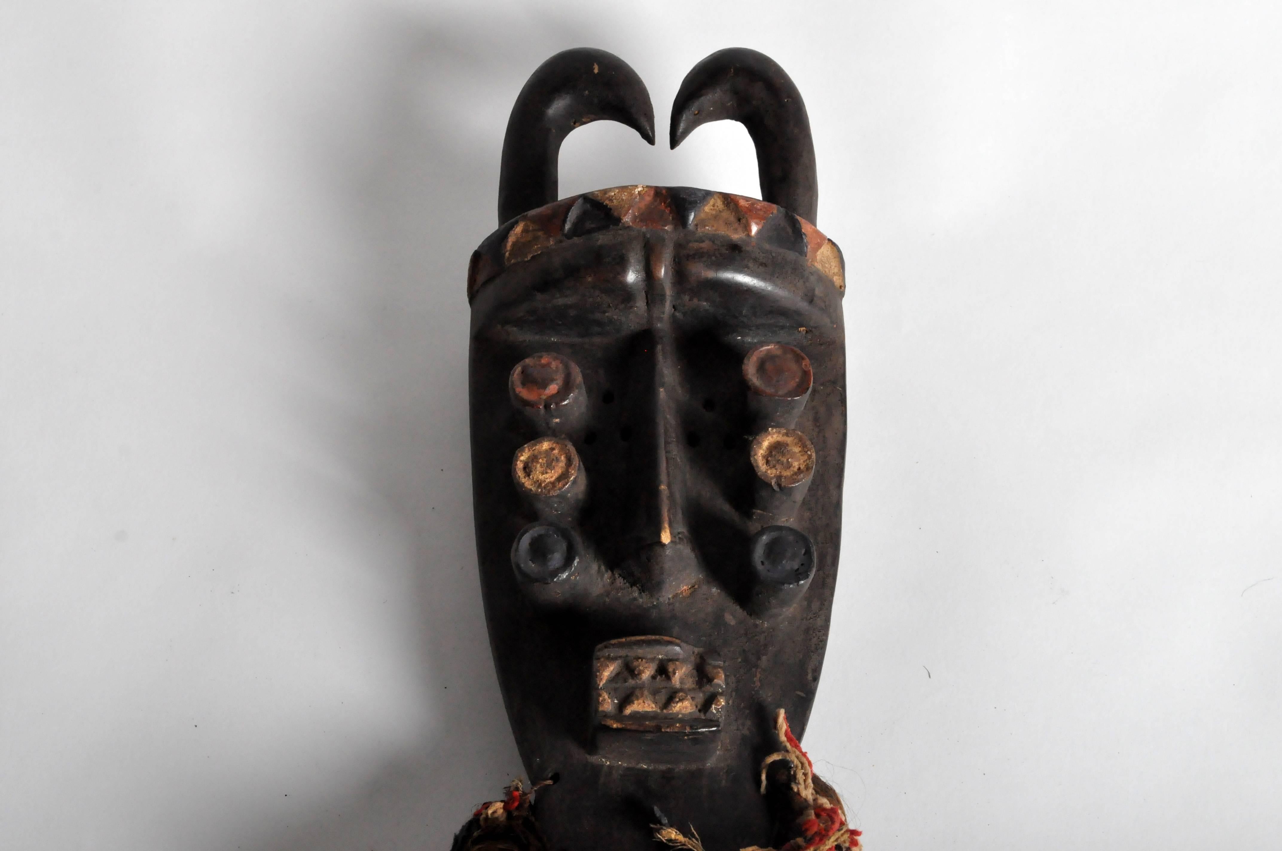 This wooden Grebo Tribe mask is from the Cote D'lvoire, circa 1950. The Grebo people is a term used to refer to an ethnic group or subgroup within the larger Kru group of West Africa, a language and cultural ethnicity, and to certain of its
