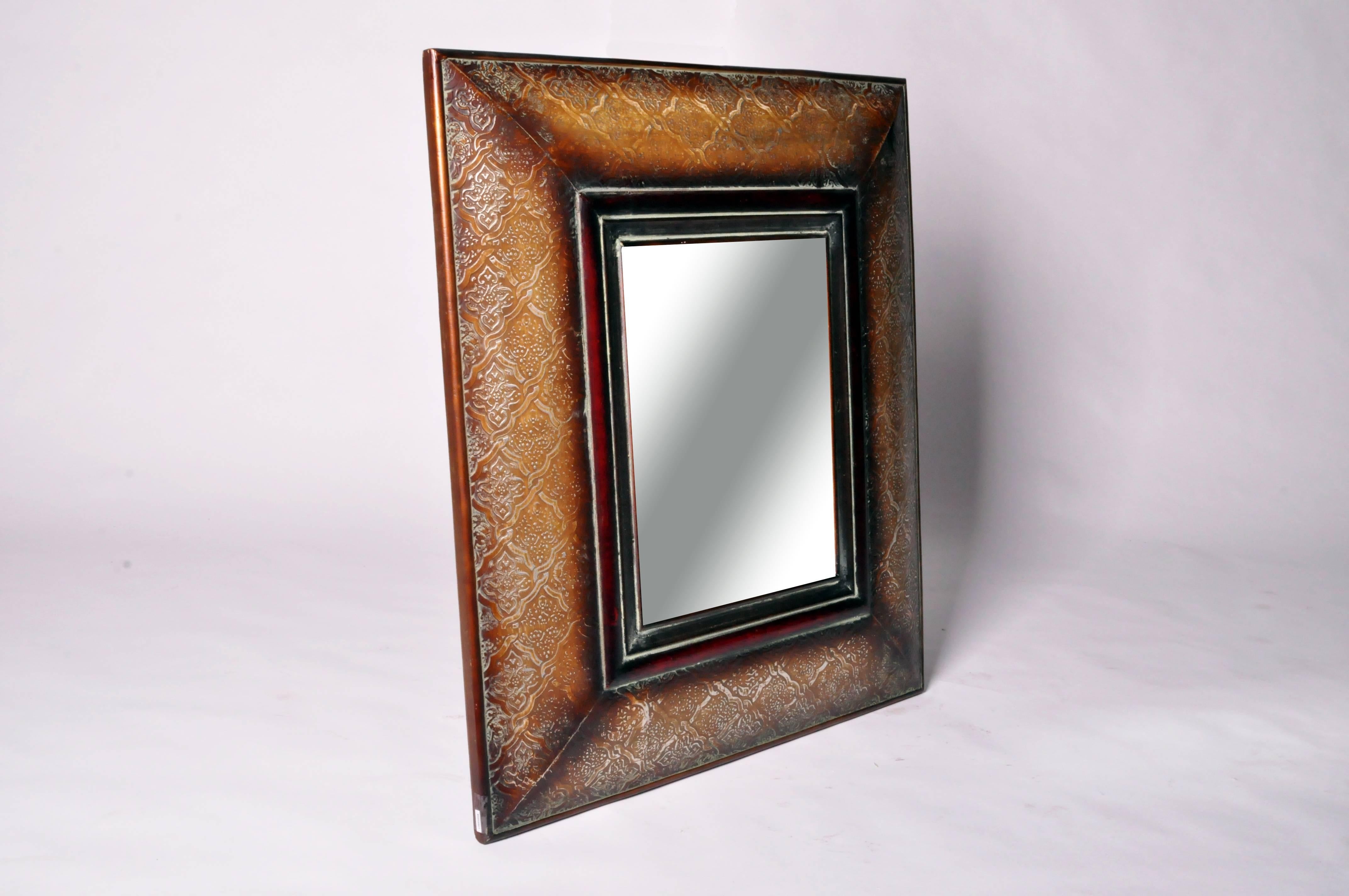 The rectangular frame is decorated with a beautifully detailed and textured quatrefoil design.