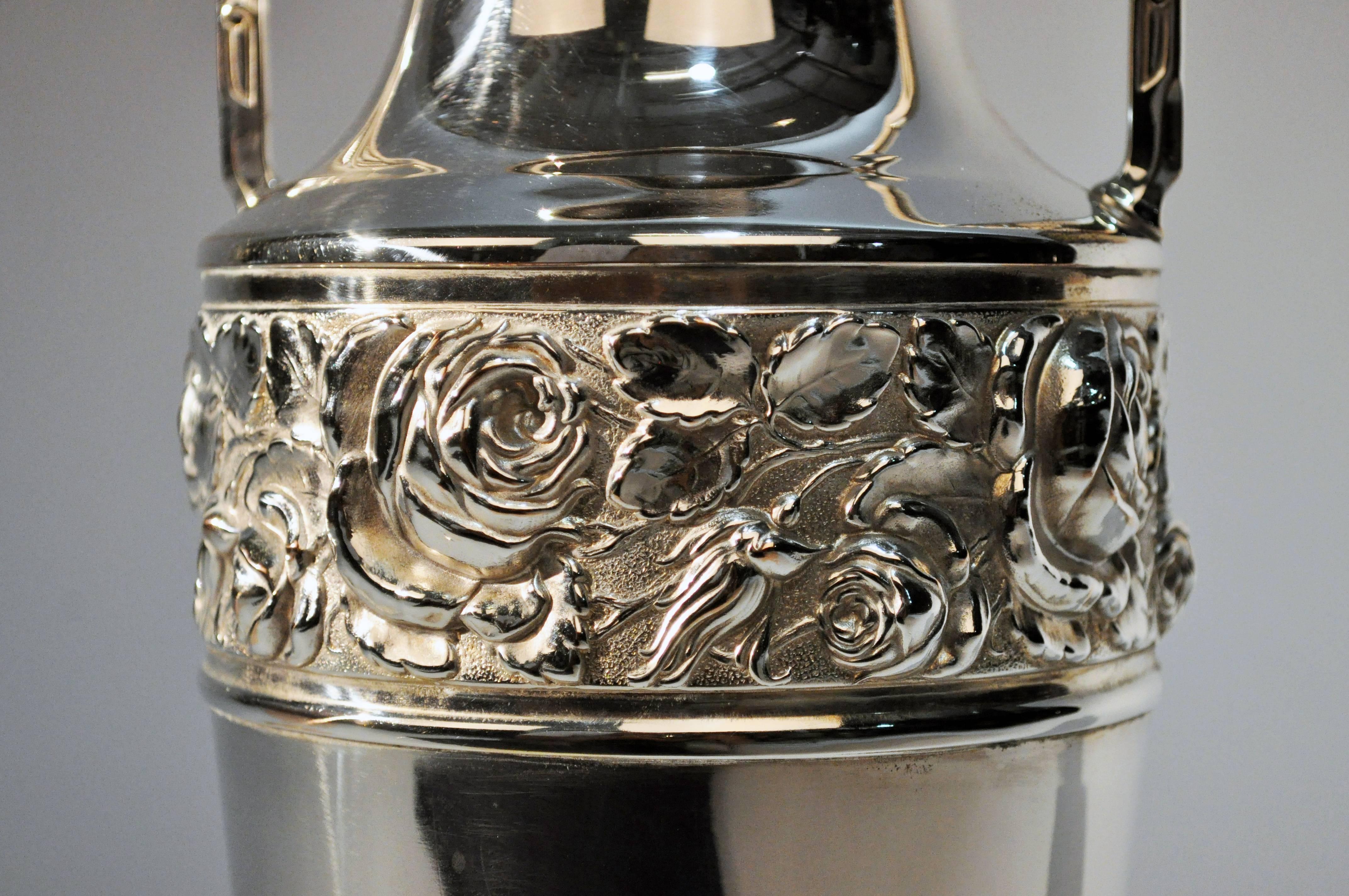 This elegant Art Deco flower vase is from France and is silver plated, circa 1930s.