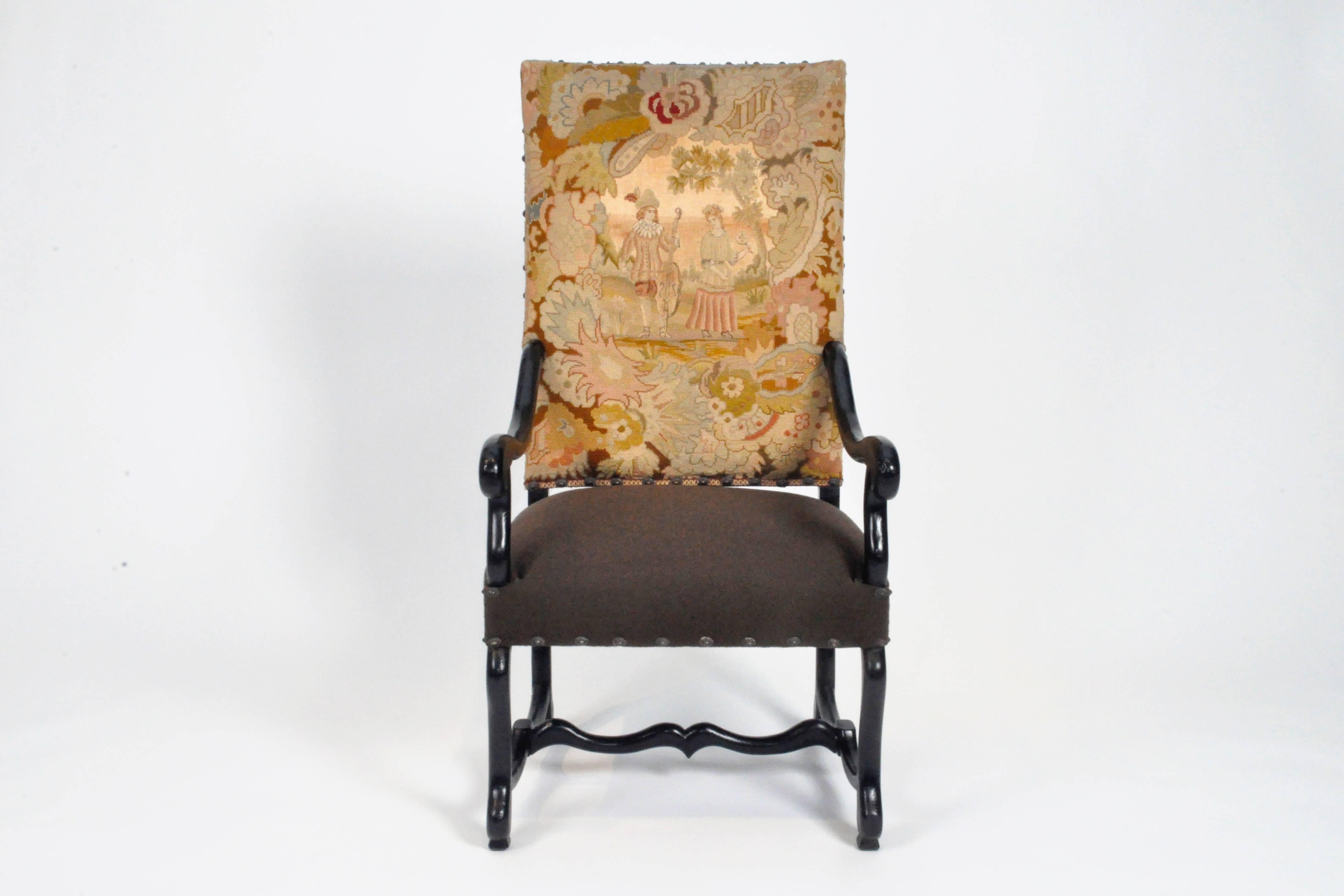 This Fauteuil armchair is from France and is made from walnut wood, circa late 1880's. Old tapestry seat back probable was added in the mid-20th Century. Bottom seat cushion is boiled wool fabric, new. The piece is sturdy and ready to use. 