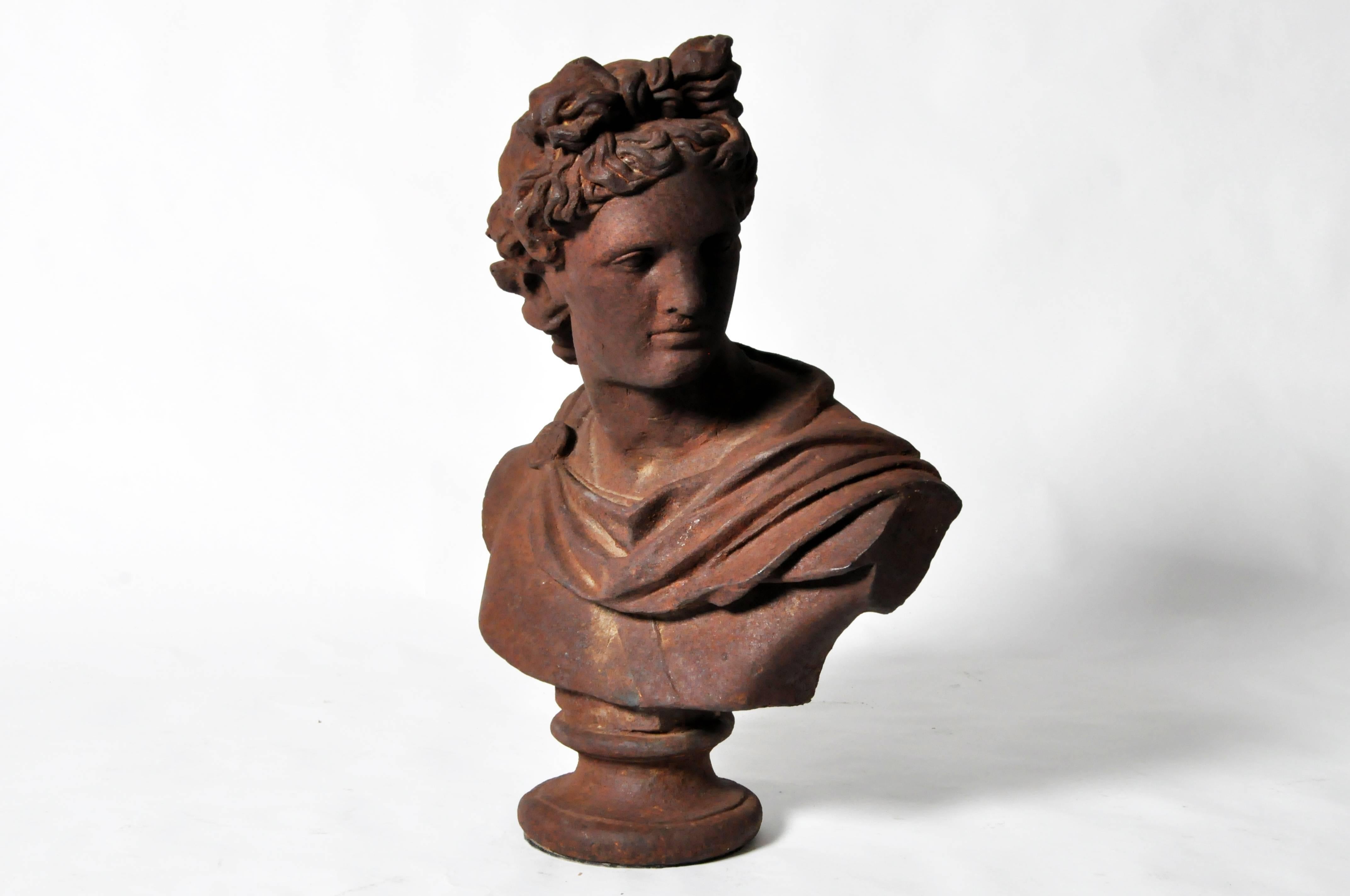 This bust replicates the celebrated marble sculpture found in the Vatican Museum. Depicted in extraordinary lifelike detail with a full head of curled tendrils and a calm, yet focused expression, Apollo is looking over his left shoulder in the