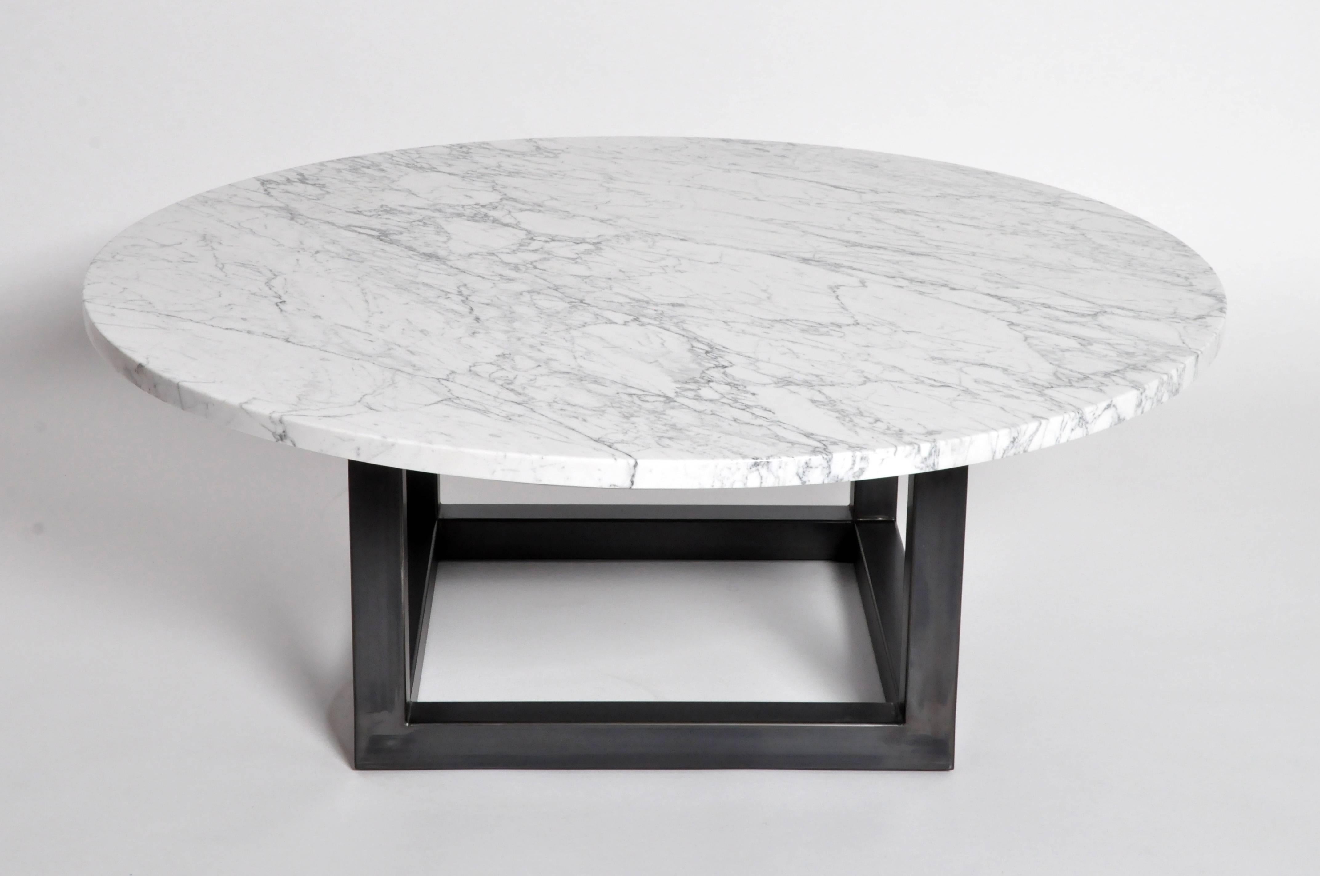 This impressive round marble coffee table is made in the USA and is made from marble and steel.