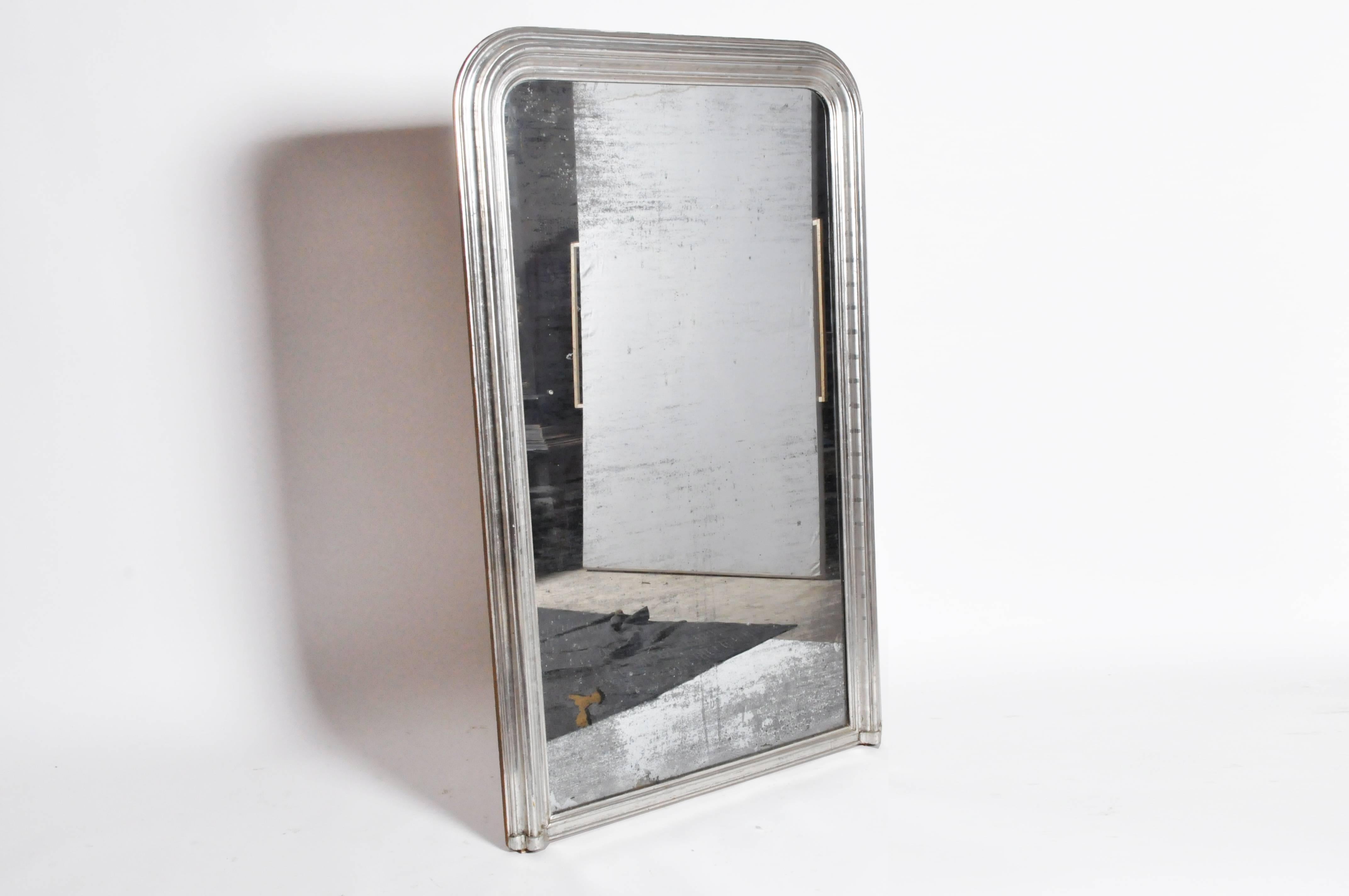 This elegant silver leaf mirror is from Italy and is made from pinewood, circa 1870. This mirror features its original glass and silver backing.