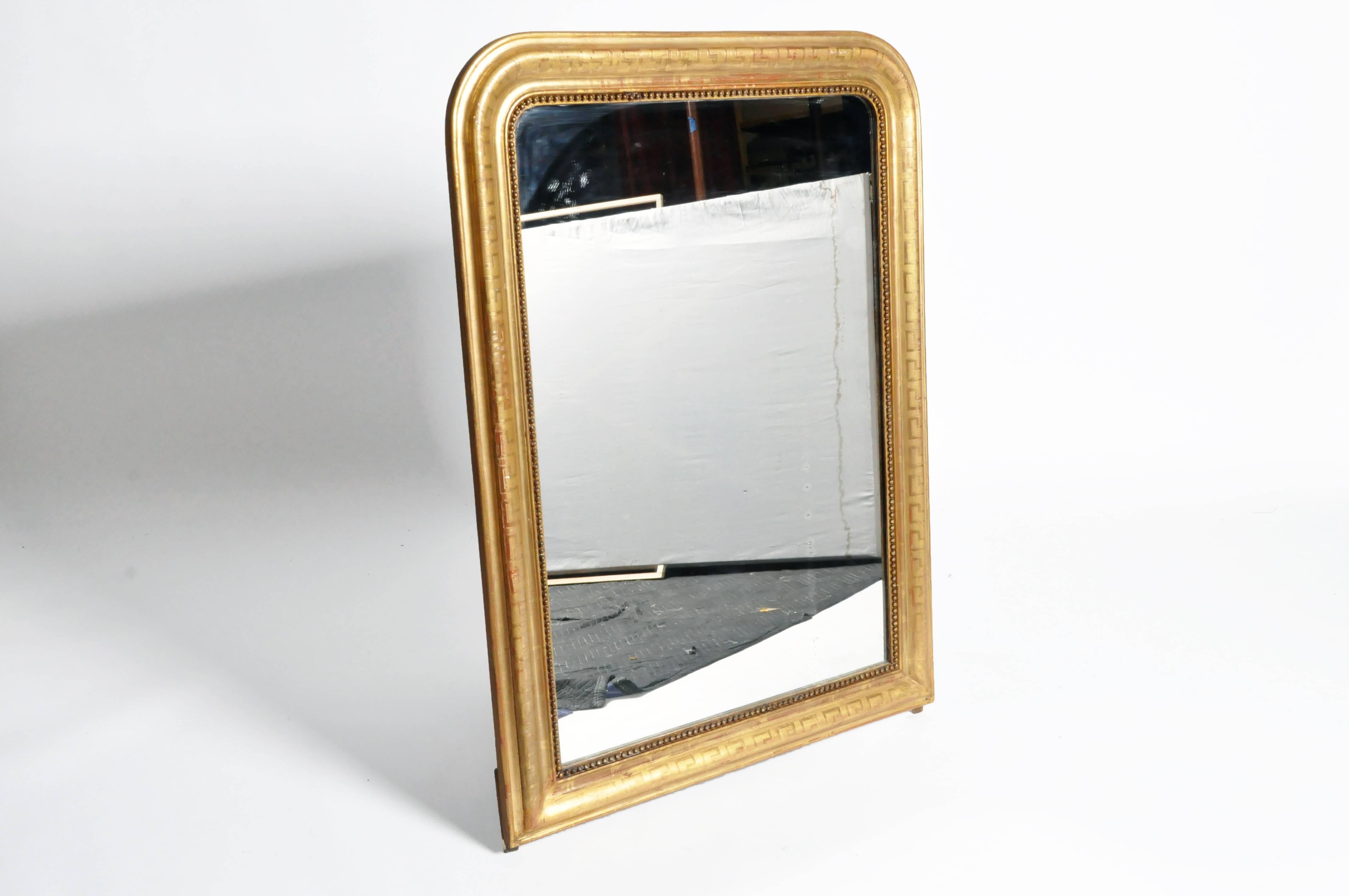 This elegant gilded mirror is from Italy and is made from pinewood, circa 1870. This piece features its original glass.