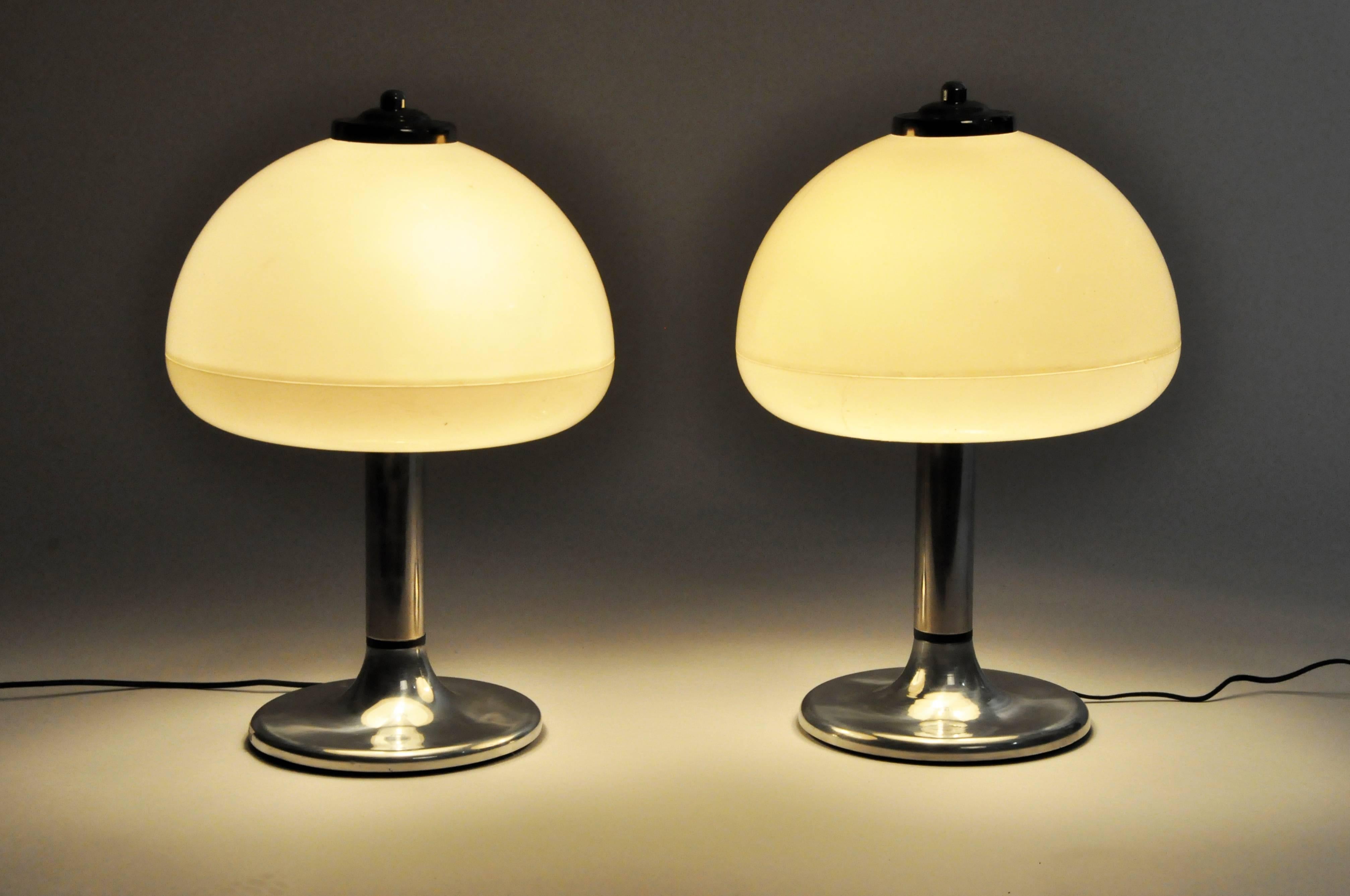 Mushroom-shaped table lamp with opaque shades and nickel base.
