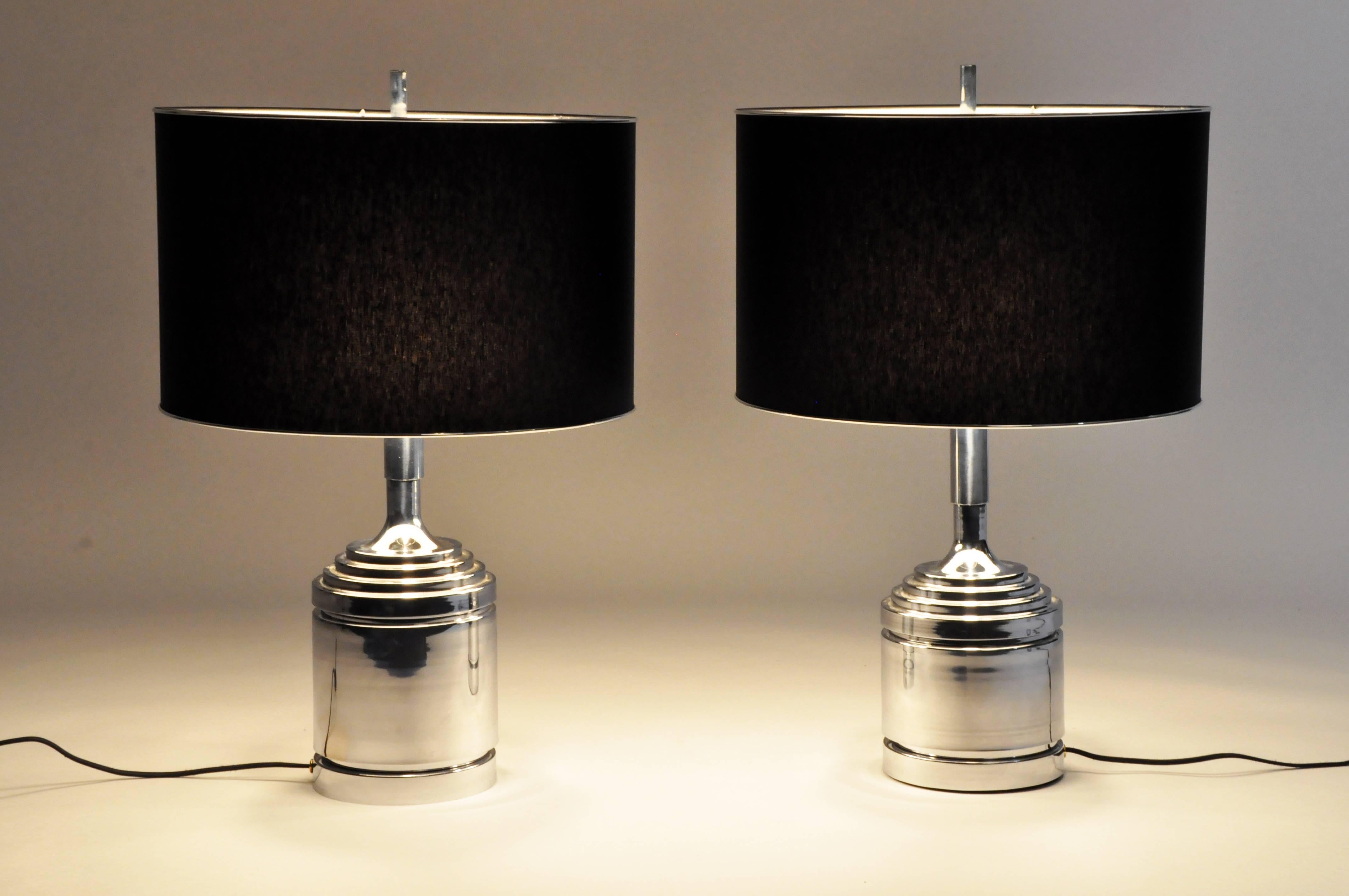 This pair of Art Deco table lamps are from Budapest, Hungary and are made from metal.