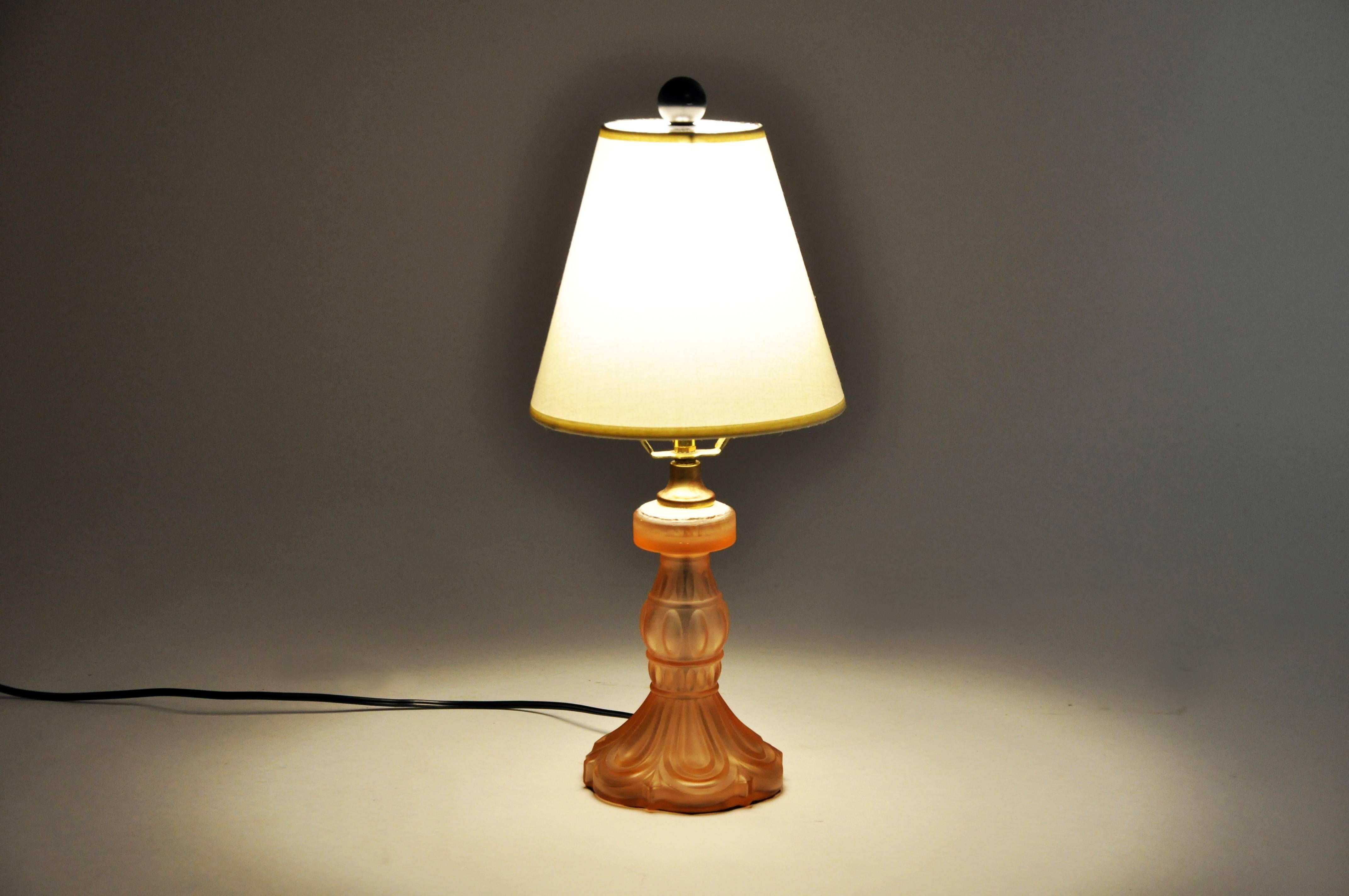 This moulded and frosted glass table lamp is from Italy, circa 20th century. A nice lamp to accent a room with color and lighting.