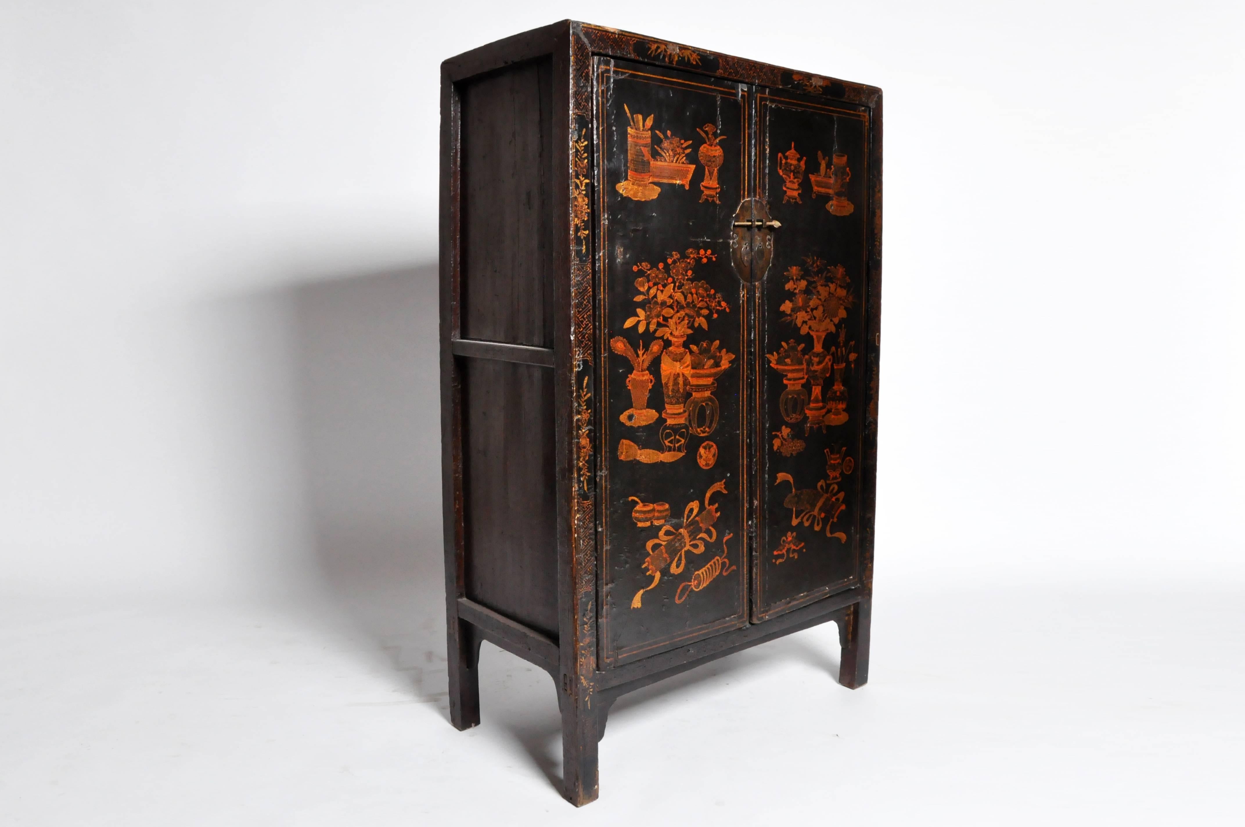 This gorgeous square-corner cabinet with hand-painted decoration hails from the Qing dynasty China, otherwise known as the Qing Empire. Furniture from this era reveals an increasing predilection for high style furniture and elaborate design as wider