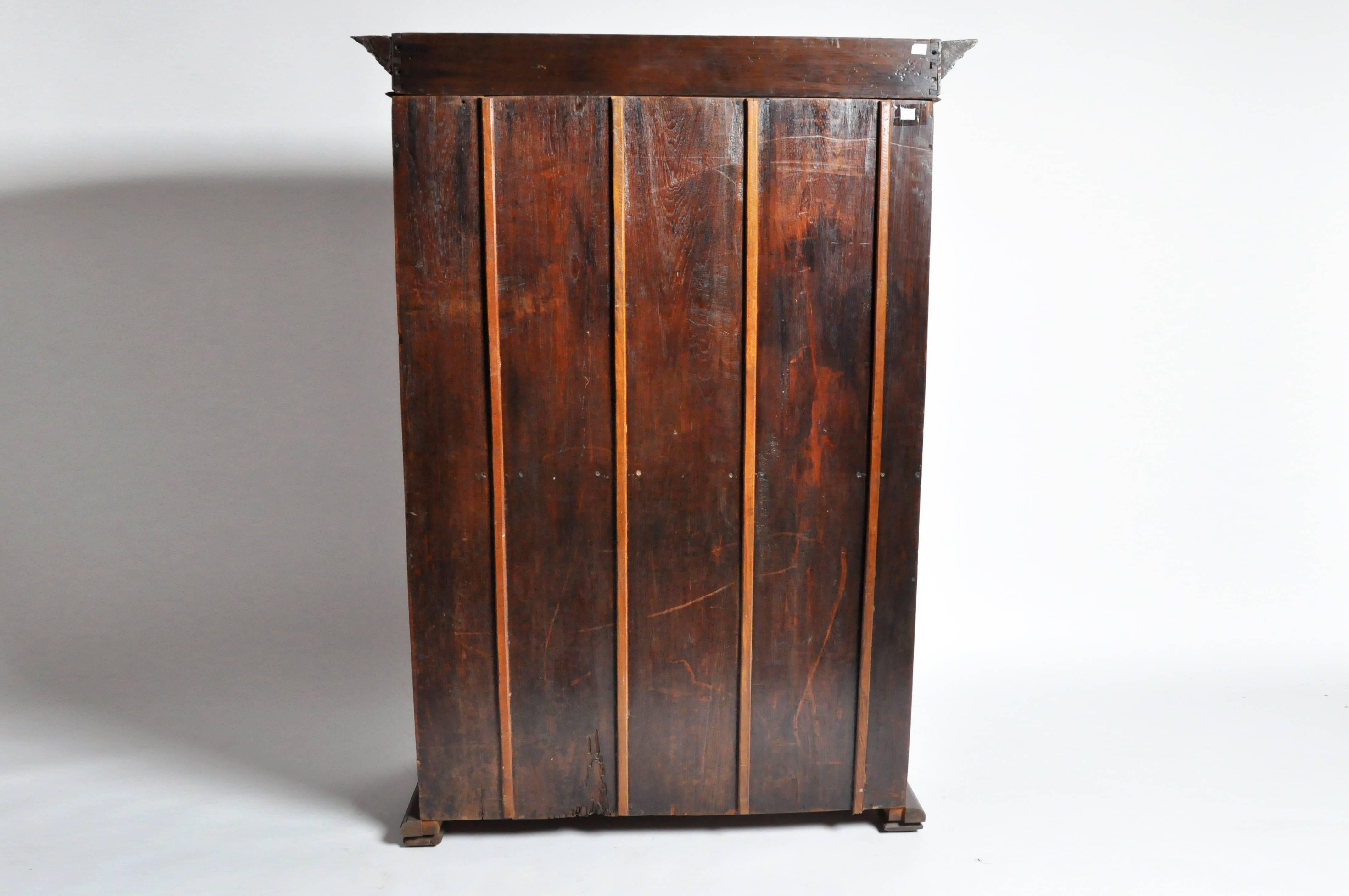 This British colonial Victorian armoire is from Northern Thailand and is made from teak wood.
