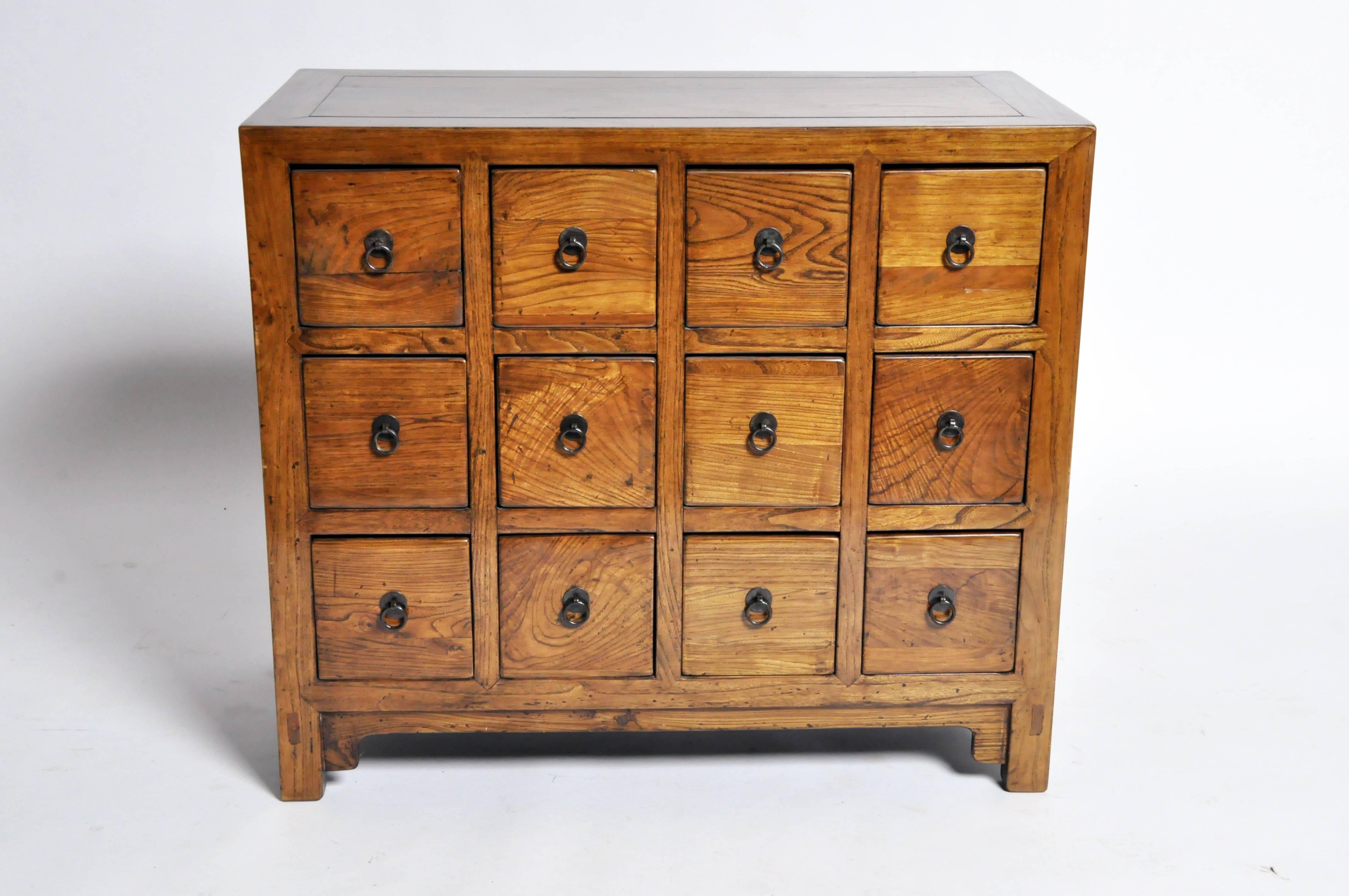 This handsome medicine chest has 12 drawers, each with a metal ring pull handle.