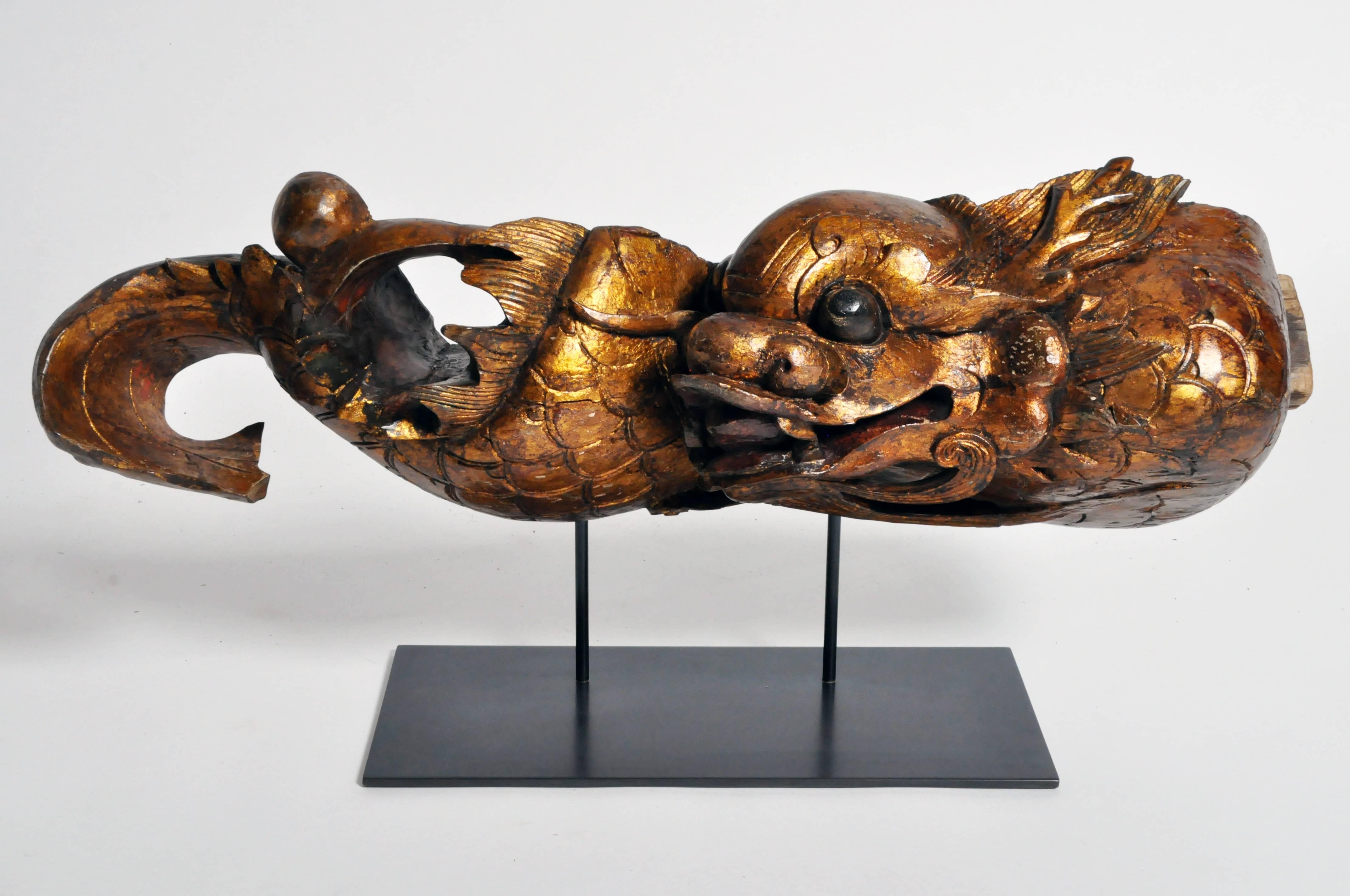 This magnificent and handsome architectural post of a dragon is from Fujian, China and is made from lacquered wood and gold paint, early 1800s. It is from the Qing Dynasty era and has been mounted on a metal base for display.

Chinese entrances