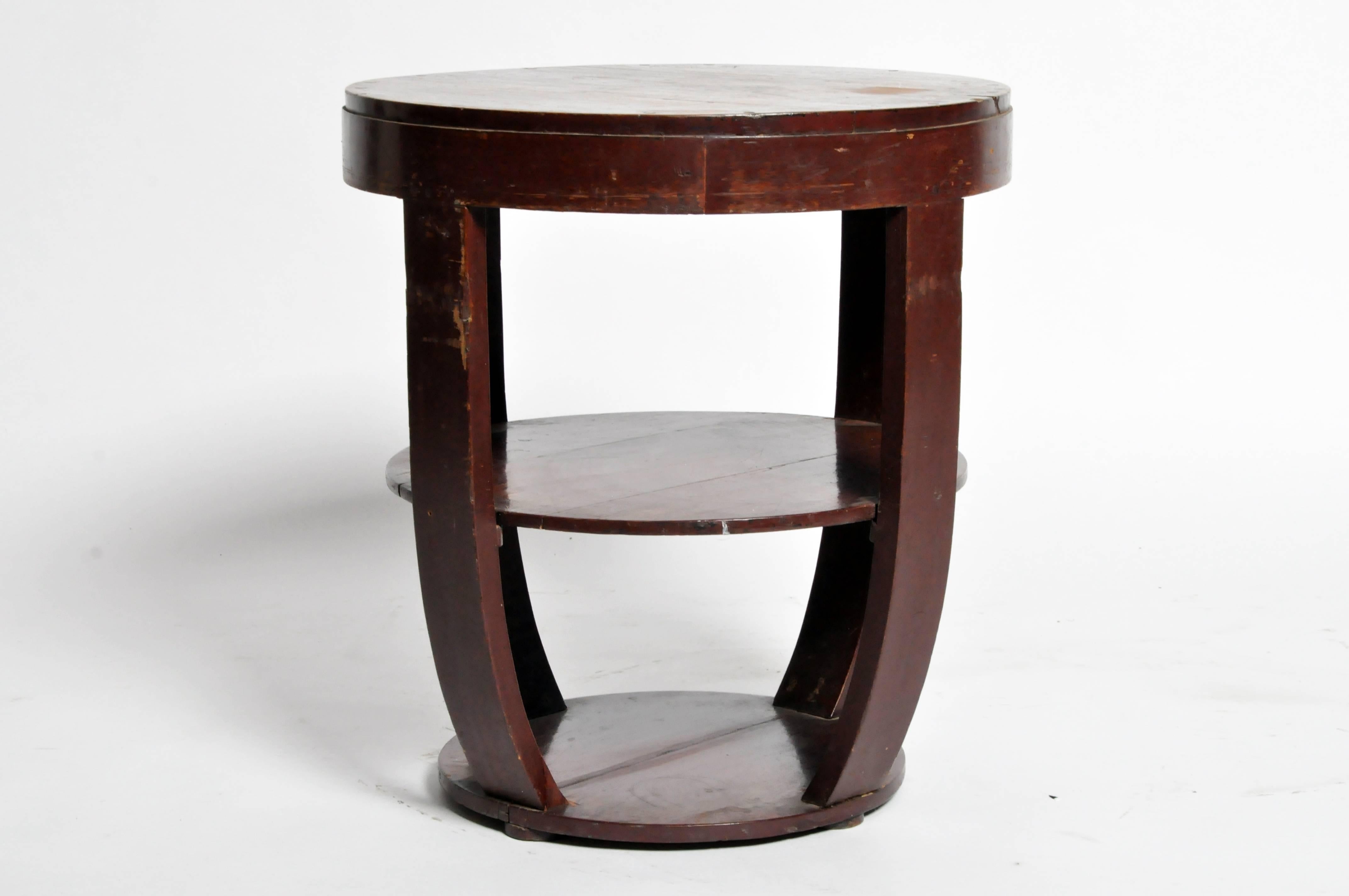 This round British Colonial Art Deco side table is made from teak wood with centre shelf made of teak wood with original varnish from Rangoon, Burma.