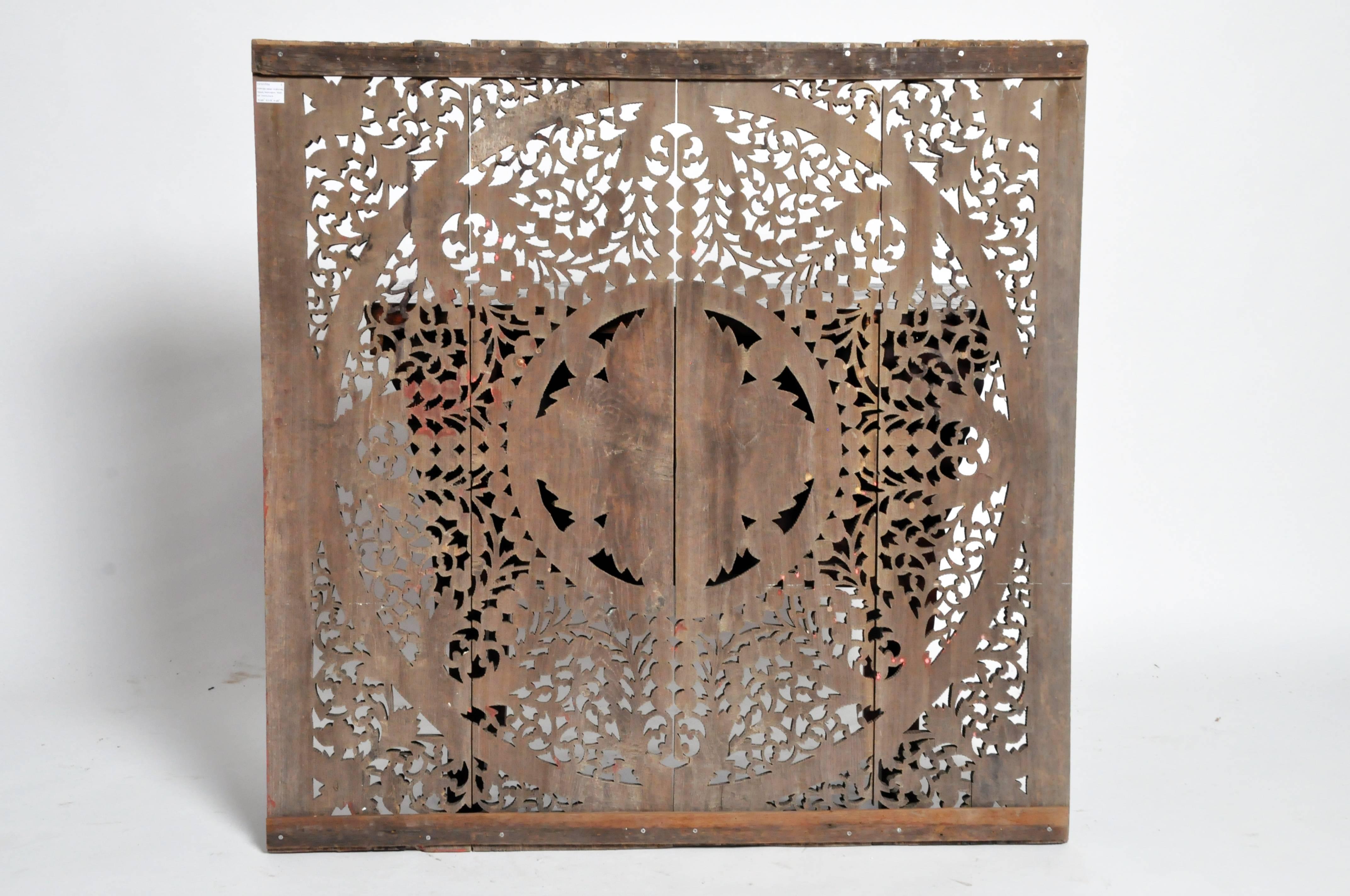 This beautifully carved ceiling panel is from Chiang Mai, Thailand. It is newly made and from teak wood and features flower motifs.