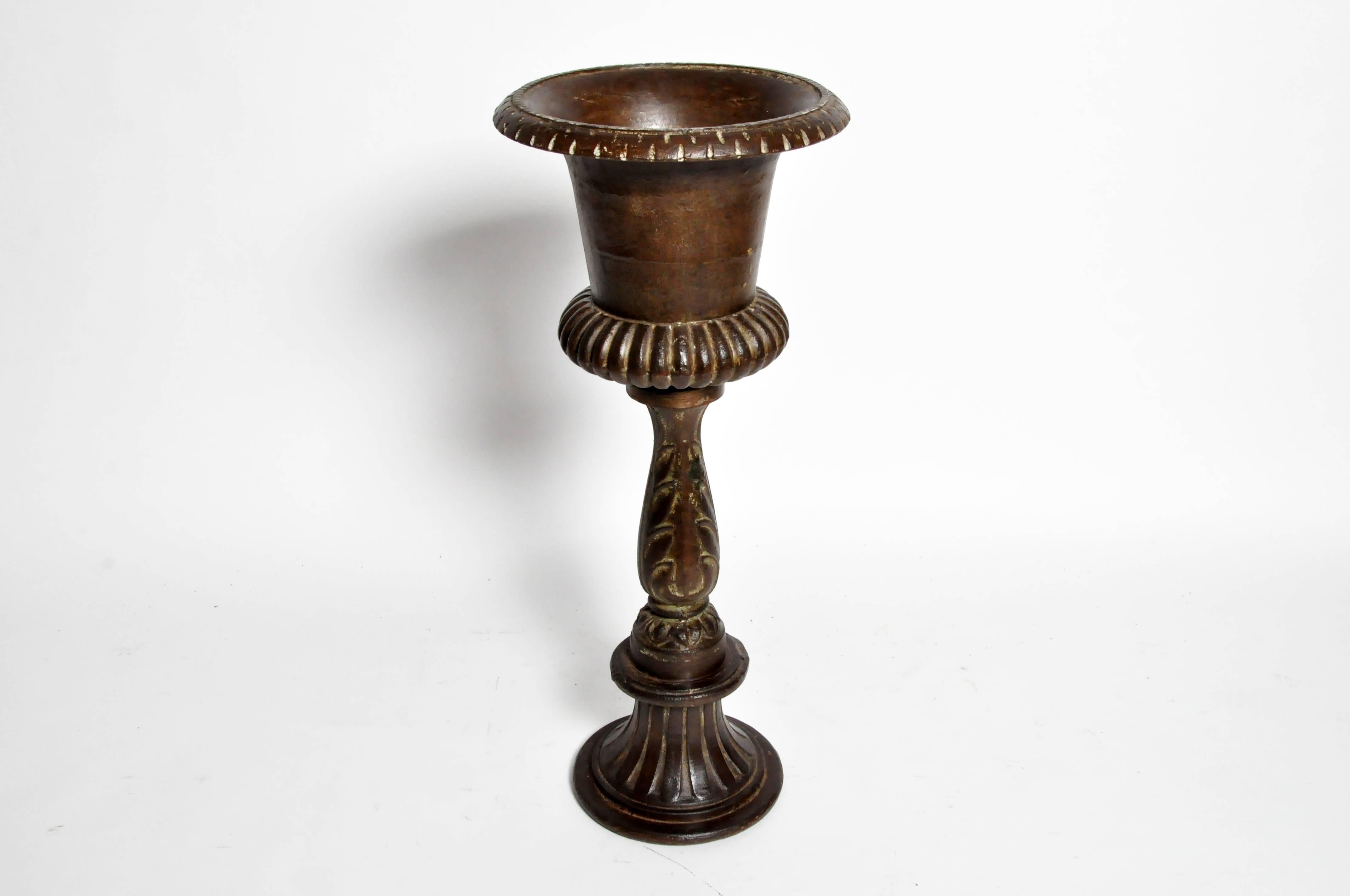 This cast iron flower pot is from Gujarat, India. Made in the mid-20th century the iron flower pot was made in the 19th century style.