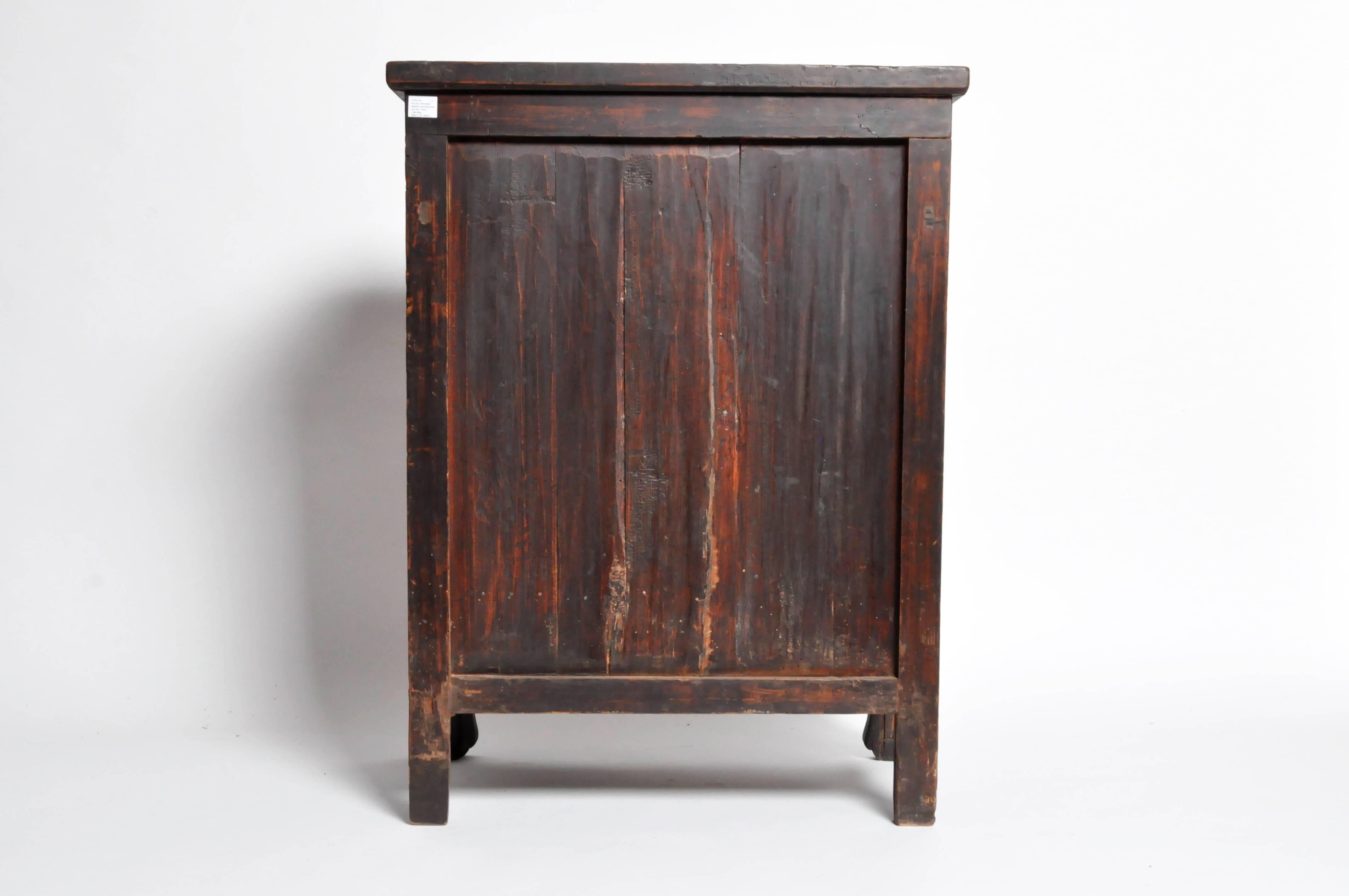 This Chinese cabinet is from the late Qing dynasty and features heavily figured wood grain on doors and drawers. Lacquer is original.