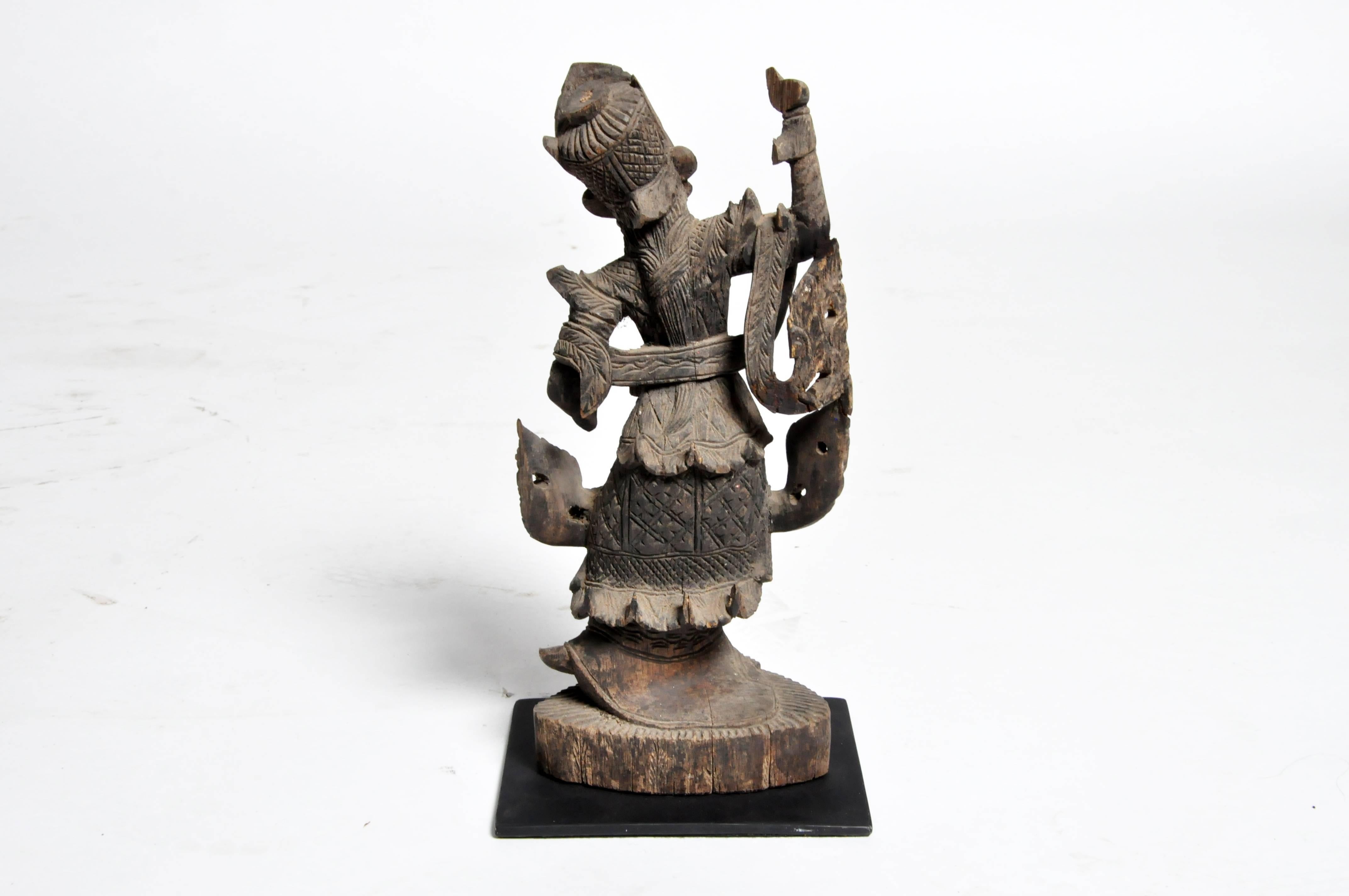 This beautifully carved Burmese dancer is from Mandalay, Burma and was made from teak wood, circa 1950.