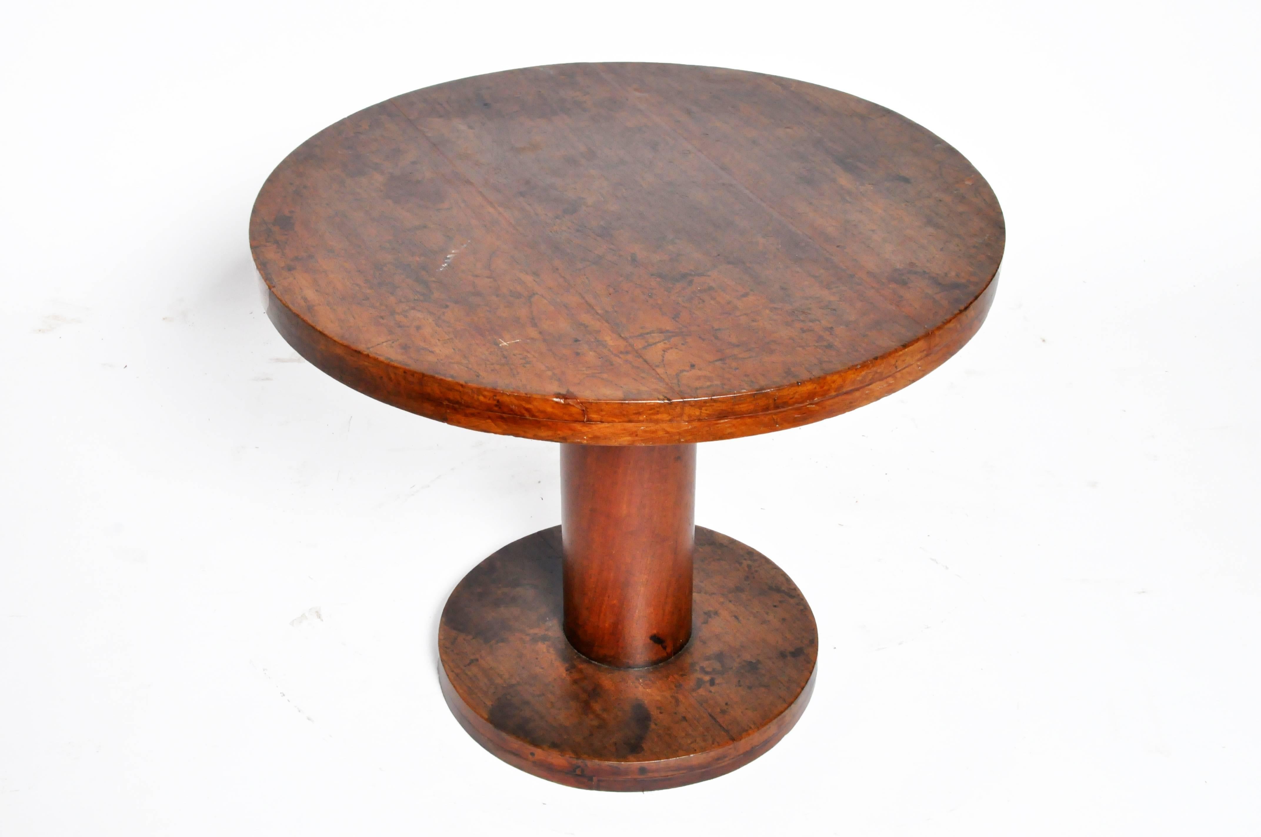 This handsome British Colonial round table is from Rangoon, Burma and was made from teak wood, circa 1950.