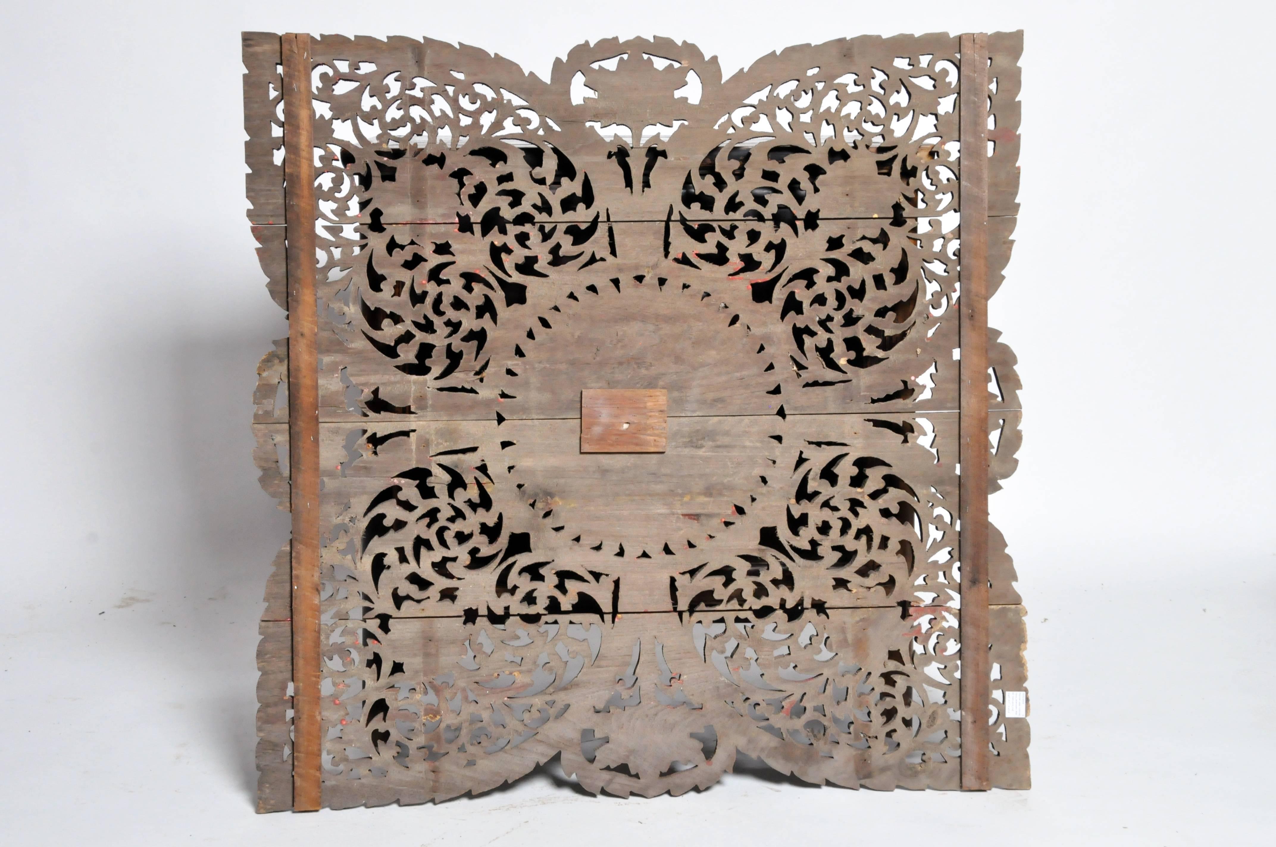 This intricate flower wood carving is made from reclaimed teak wood and comes from Northern Thailand.
