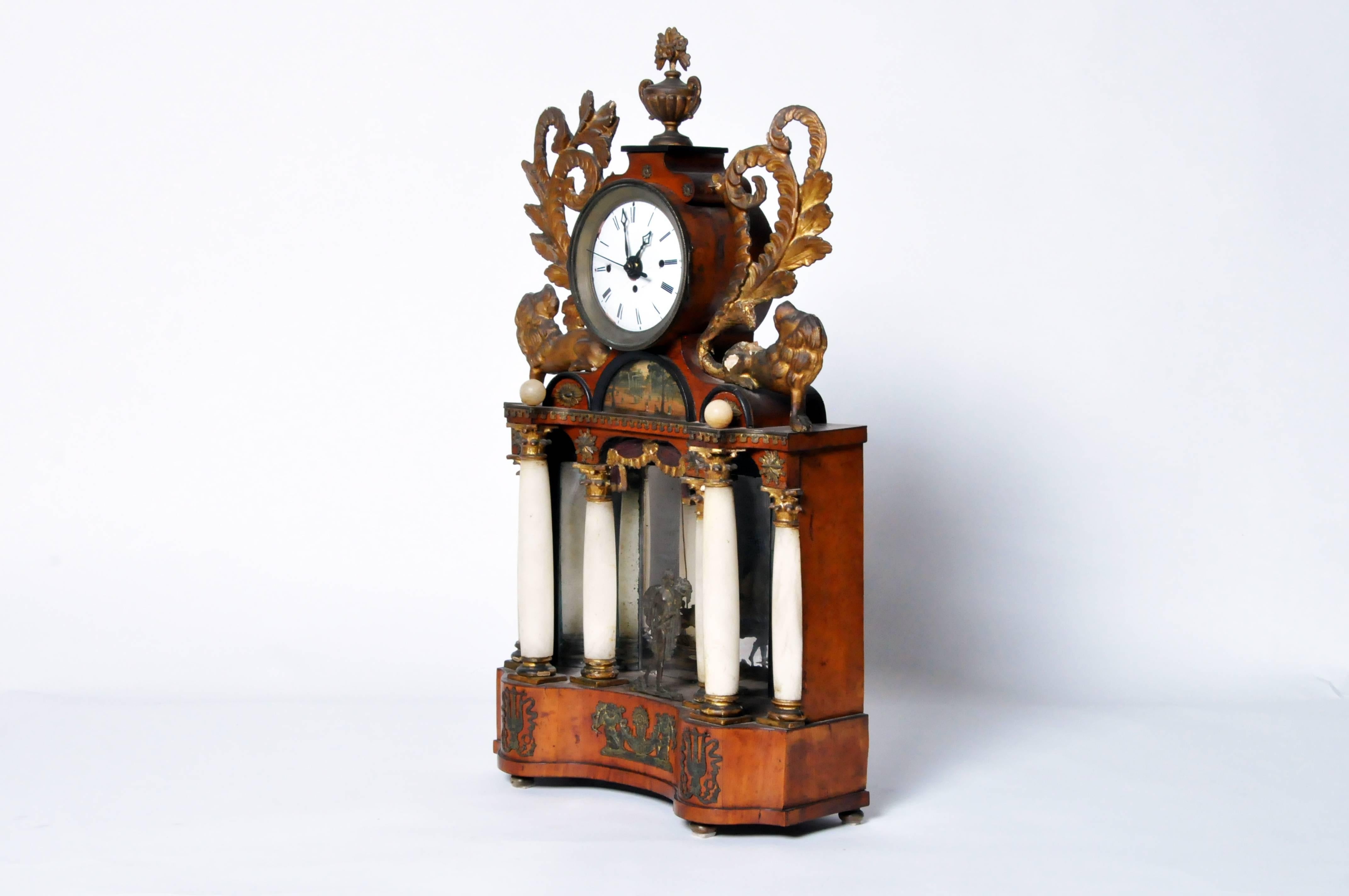 This gorgeous alabaster mantel clock is from Austria, circa 1900. This piece is made from alabaster, giltwood, and burl wood.