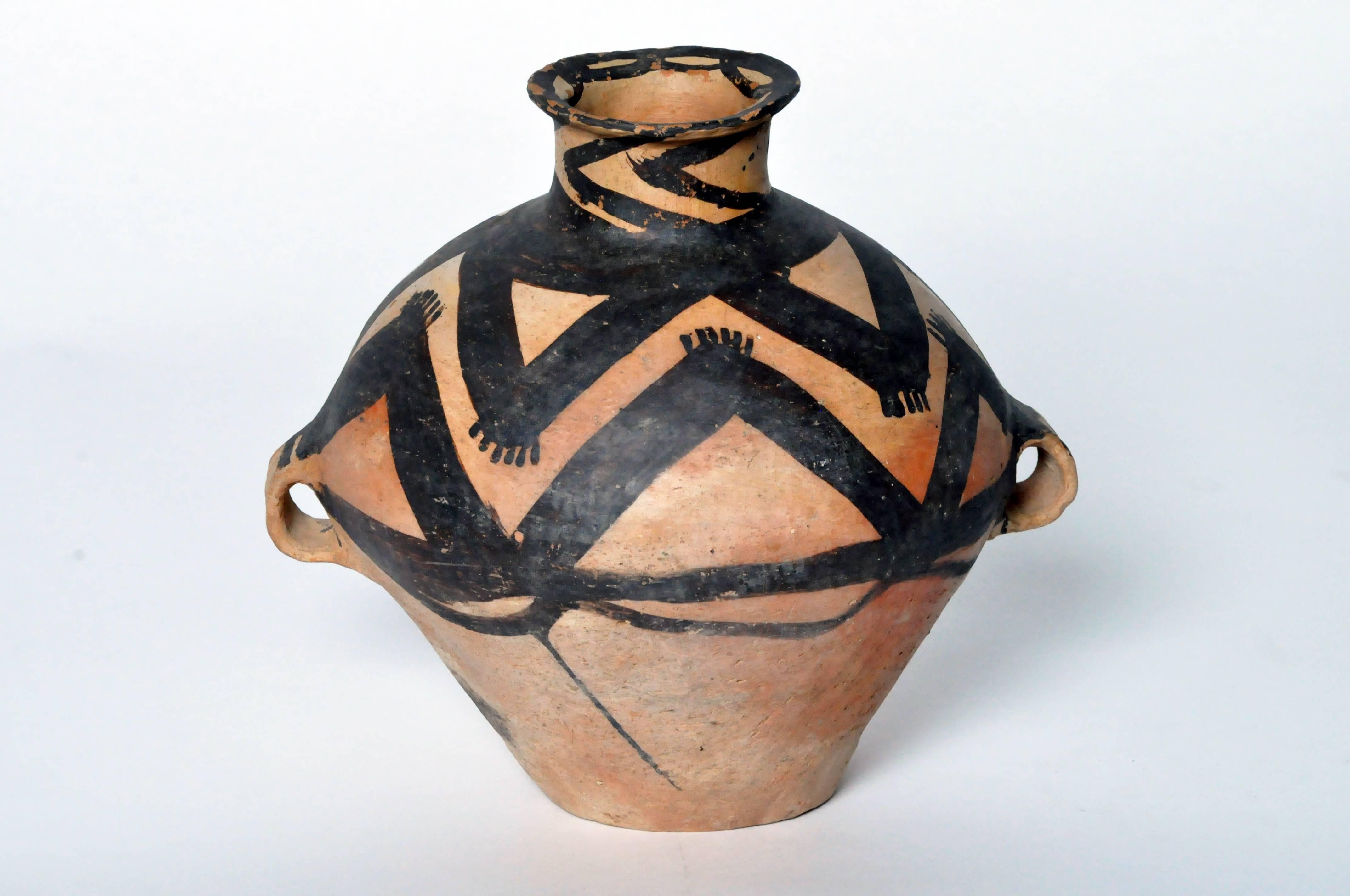 This jar was made in the Yangshao culture and is of the Ma-ch’ang type. This culture thrived in the northwestern part of China along and around the Yellow River between 3000 B.C. and 1700 B.C. The piece is in very good condition with no cracks to