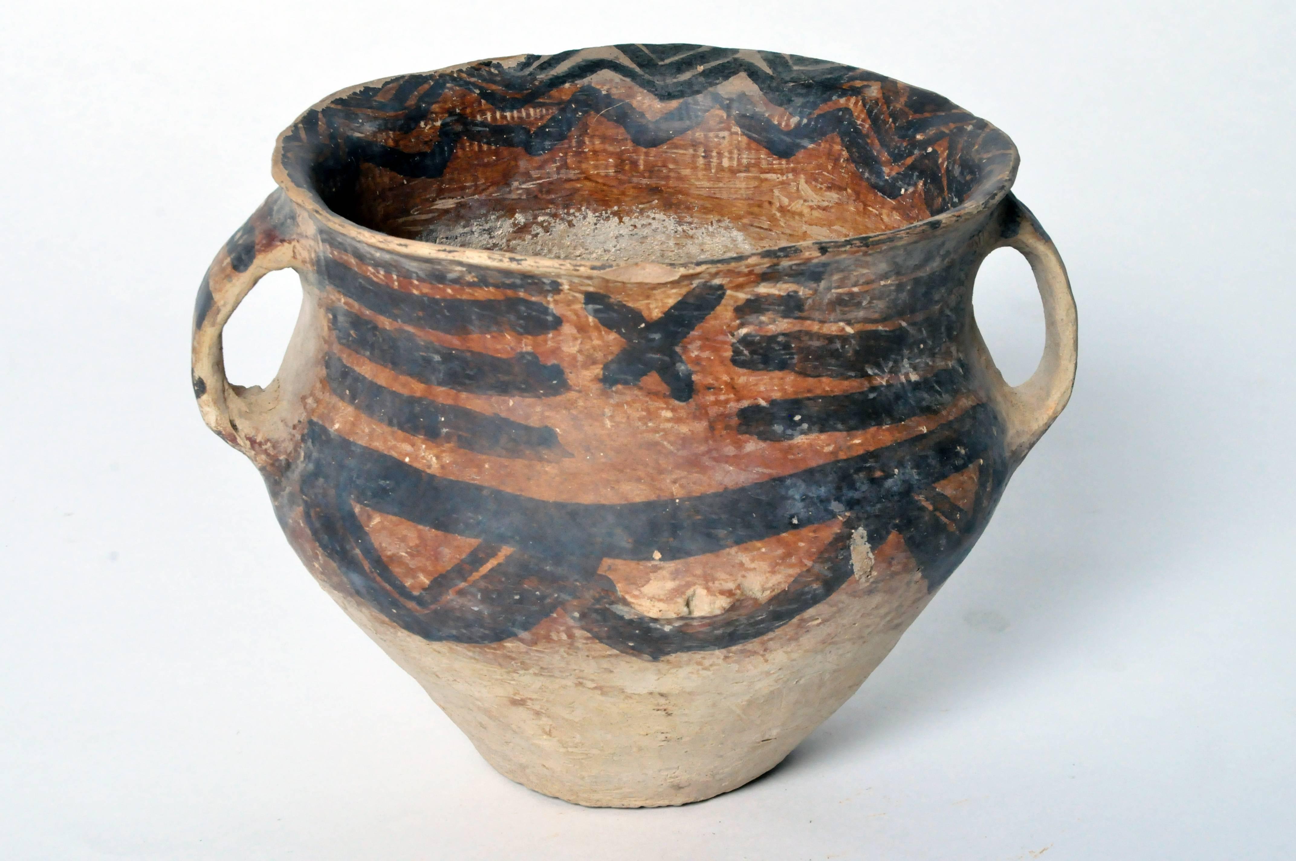 This jar was made in the Yangshao culture and is of the Machiayao type. This culture thrived in the northwestern part of China along and around the Yellow River between 3000 BC and 1700 BC The piece is in very good condition with no cracks to the
