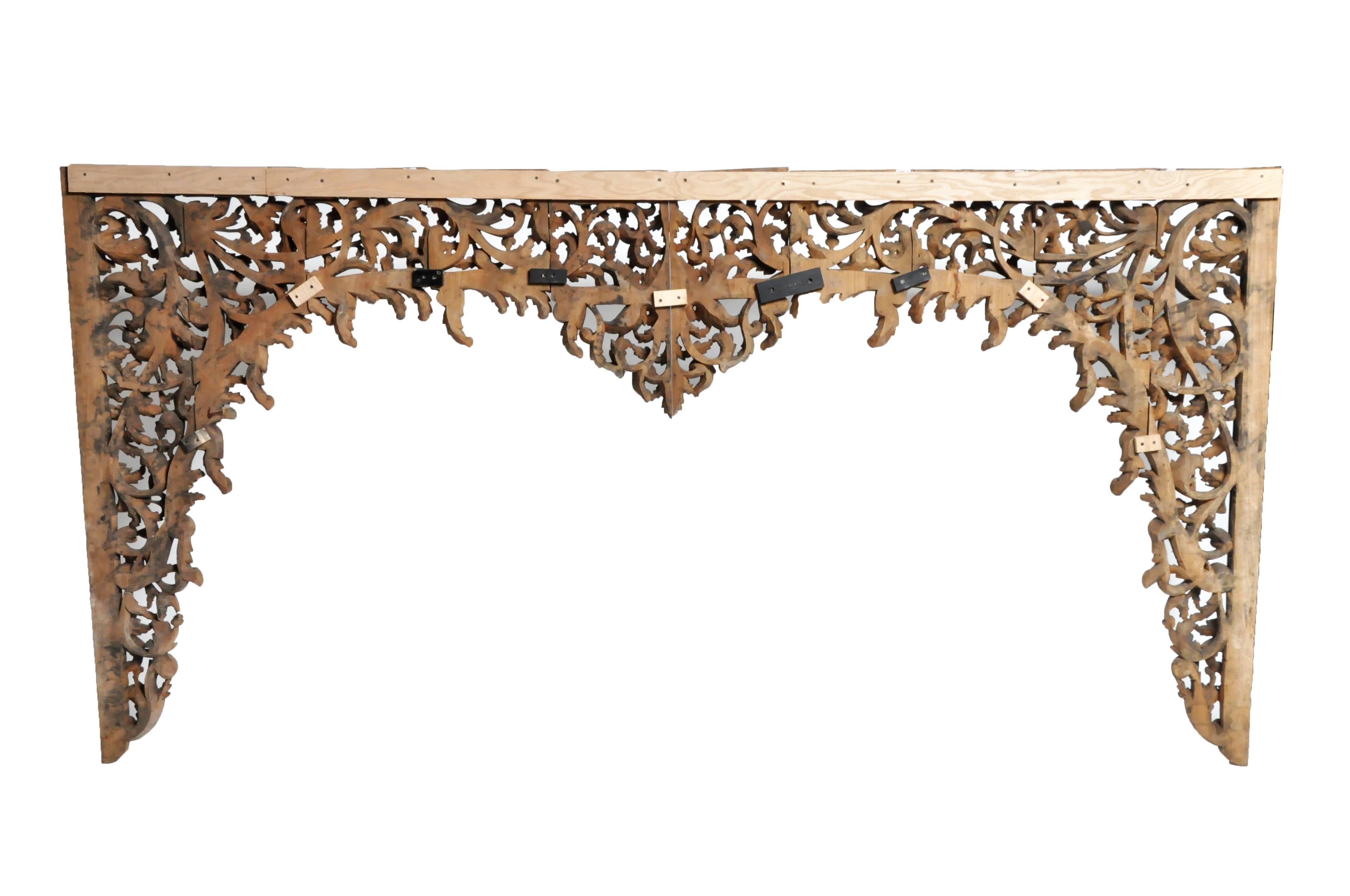 This hand carved Burmese arch was made from Teak wood. This impressive decoration features vine and floral motifs and were made according to post.