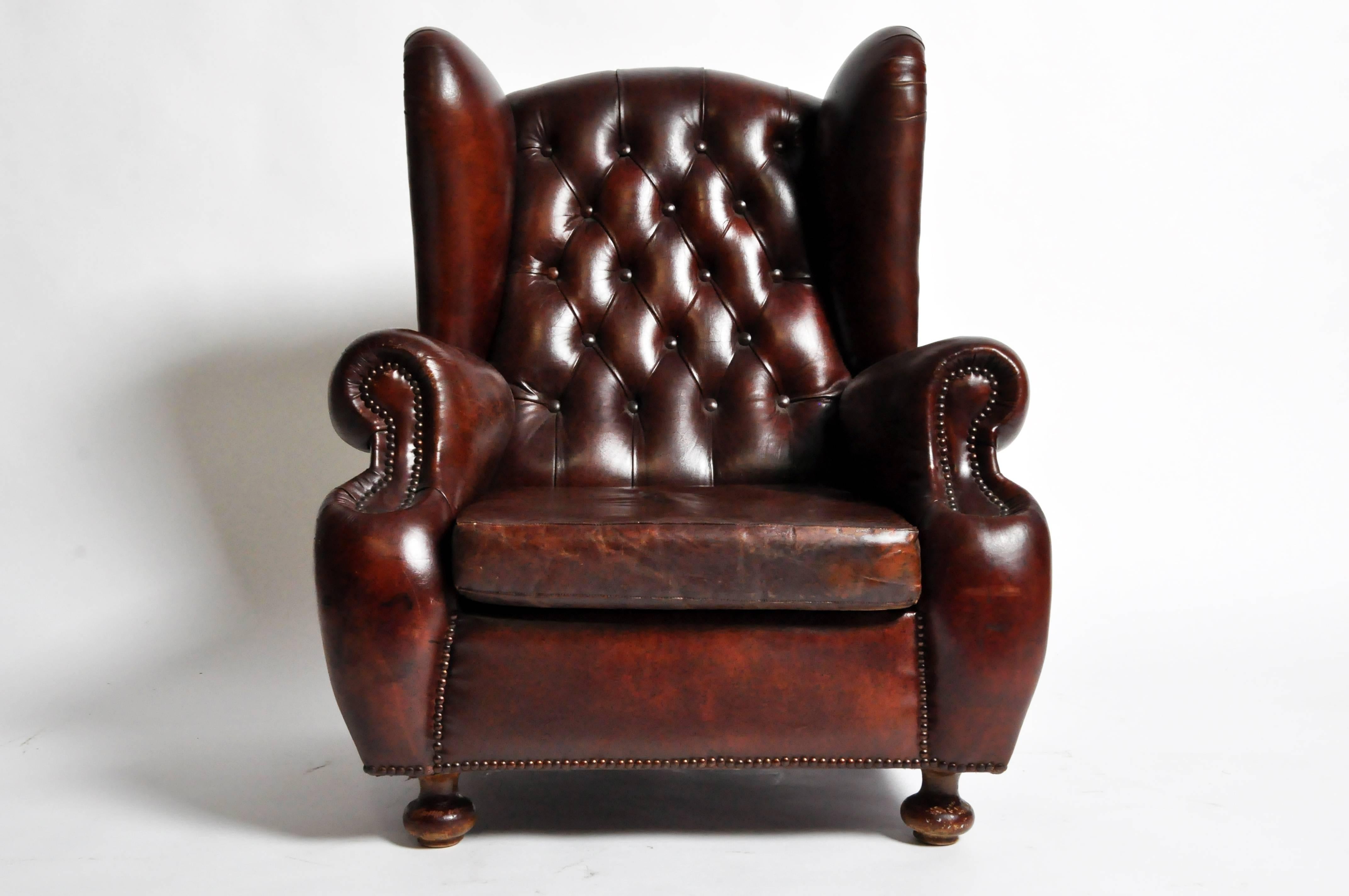 This handsome tufted wing back club chair is from England and was made from leather, c. 1960.  

19.5