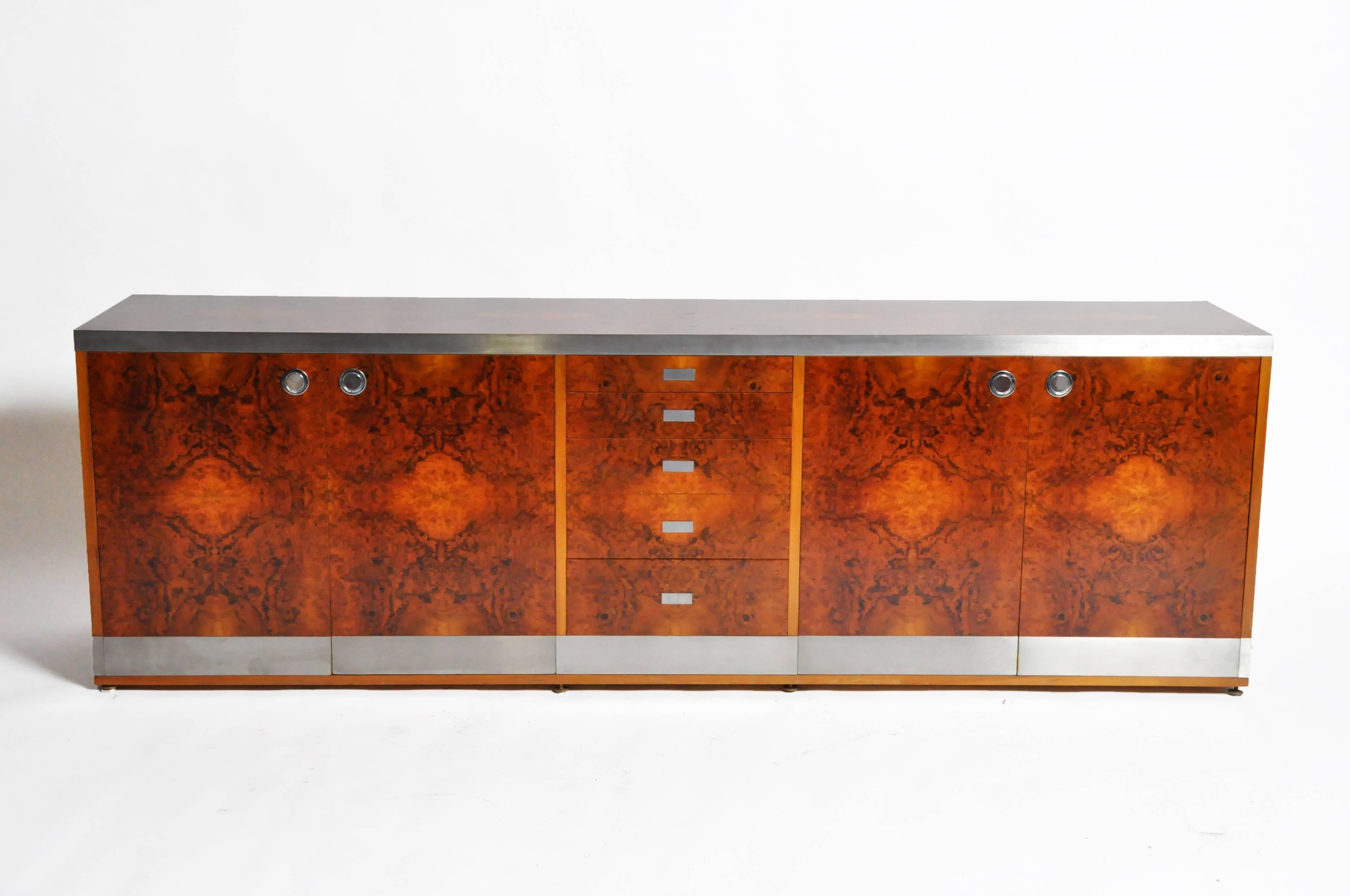This Willy Rizzo console is from France and was made from walnut veneer and chrome, circa 1970. The elegant piece features five drawers and additional shelves for ample storage. 

Willy Rizzo's furniture design channeled the sophistication of Mies