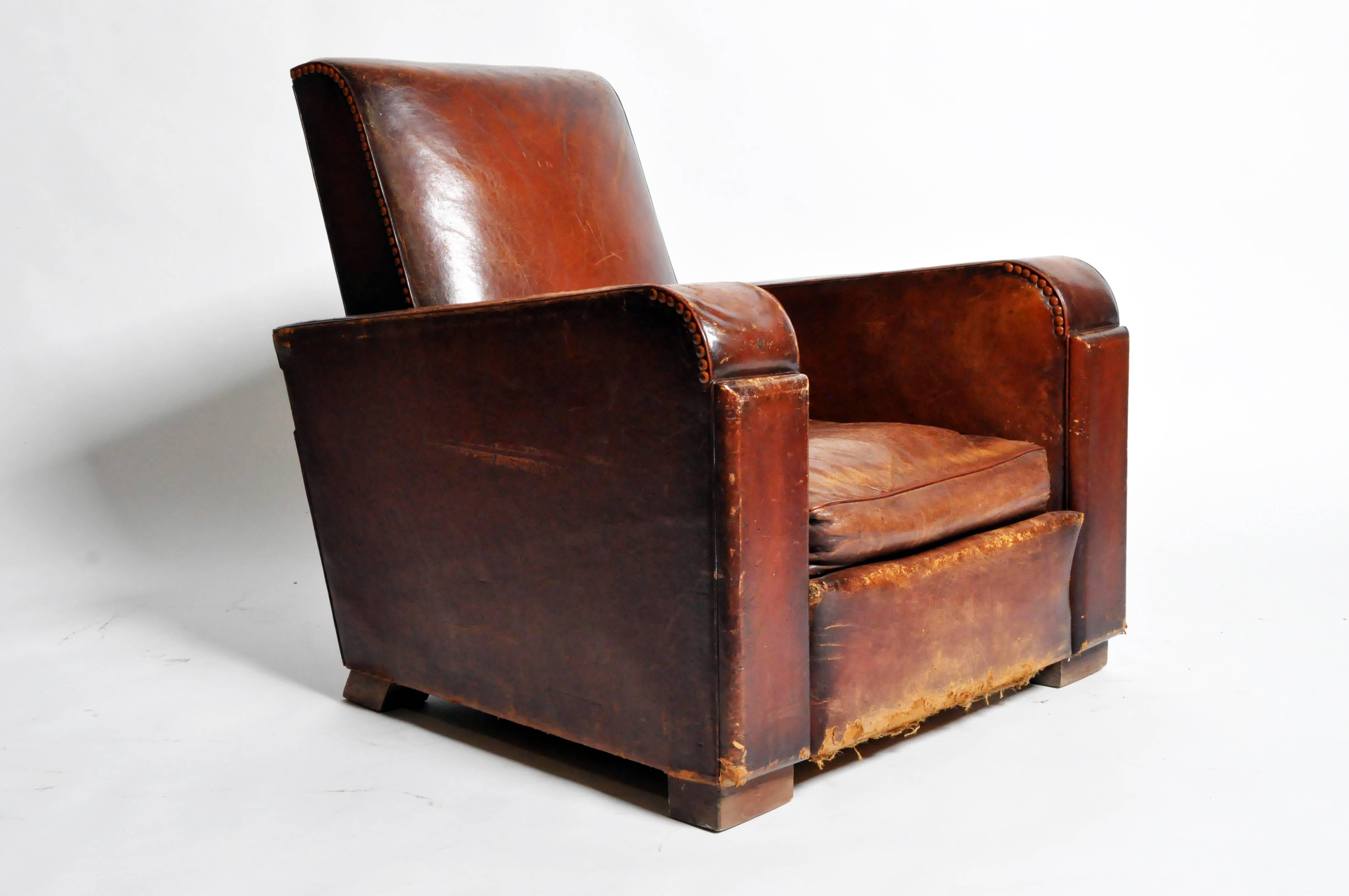 This handsome Art Deco leather chair is from Paris, France and was made from leather, c. 1940. The chair features its original leather and a beautifully aged patina. 

Additional dimensions: 20